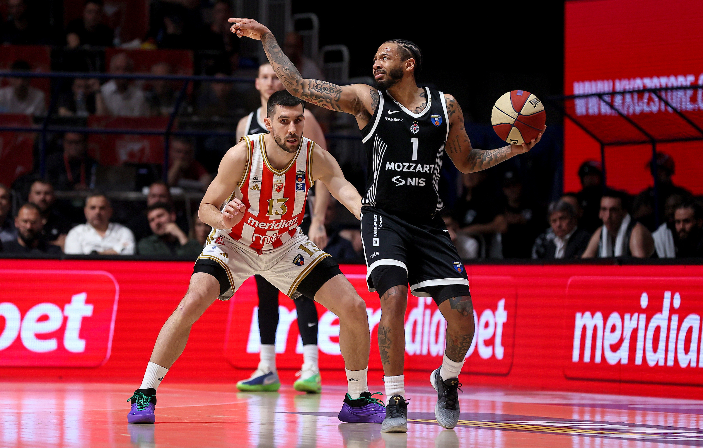 Ognjen Dobric of Crvena Zvezda (L) in action against Carlik Jones of Partizan