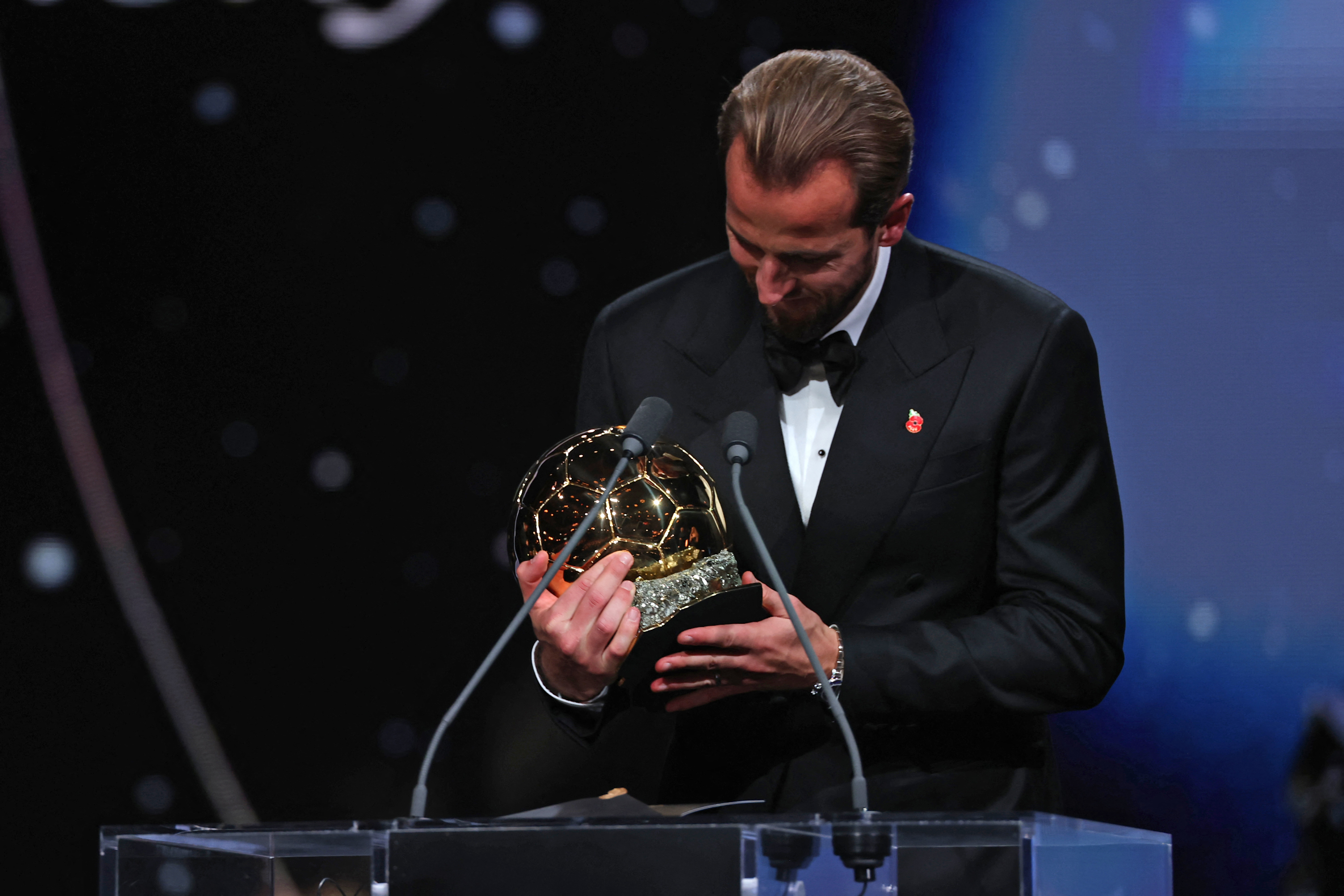England and Bayern Munich forward Harry Kane reacts after receiving the