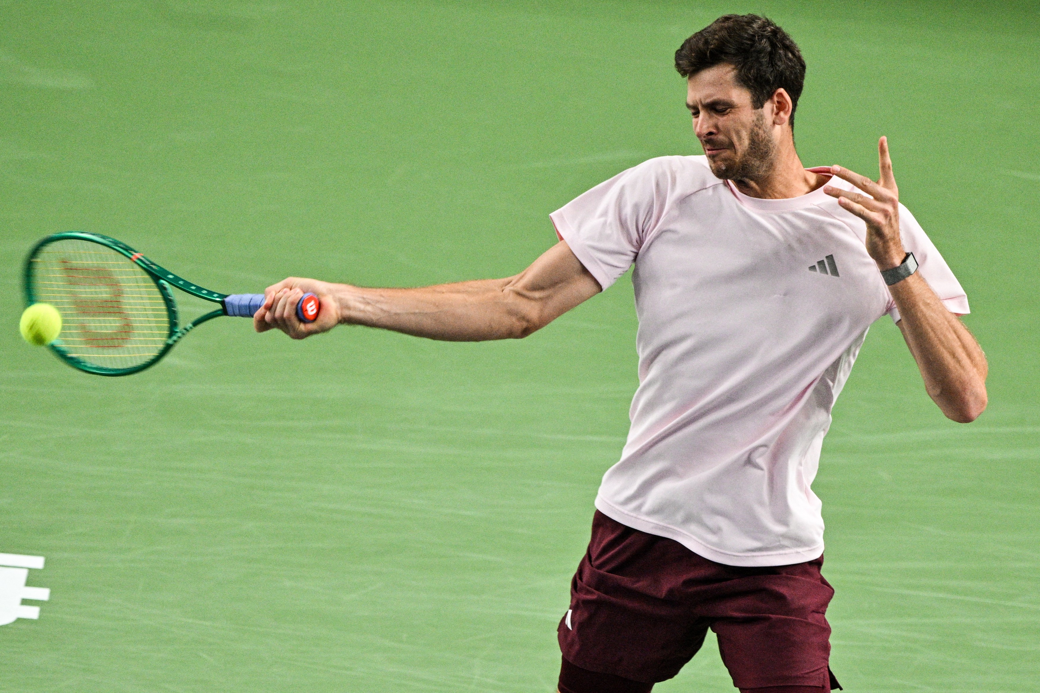 Poland's Hubert Hurkacz hits a return to Serbia's Novak Djokovic