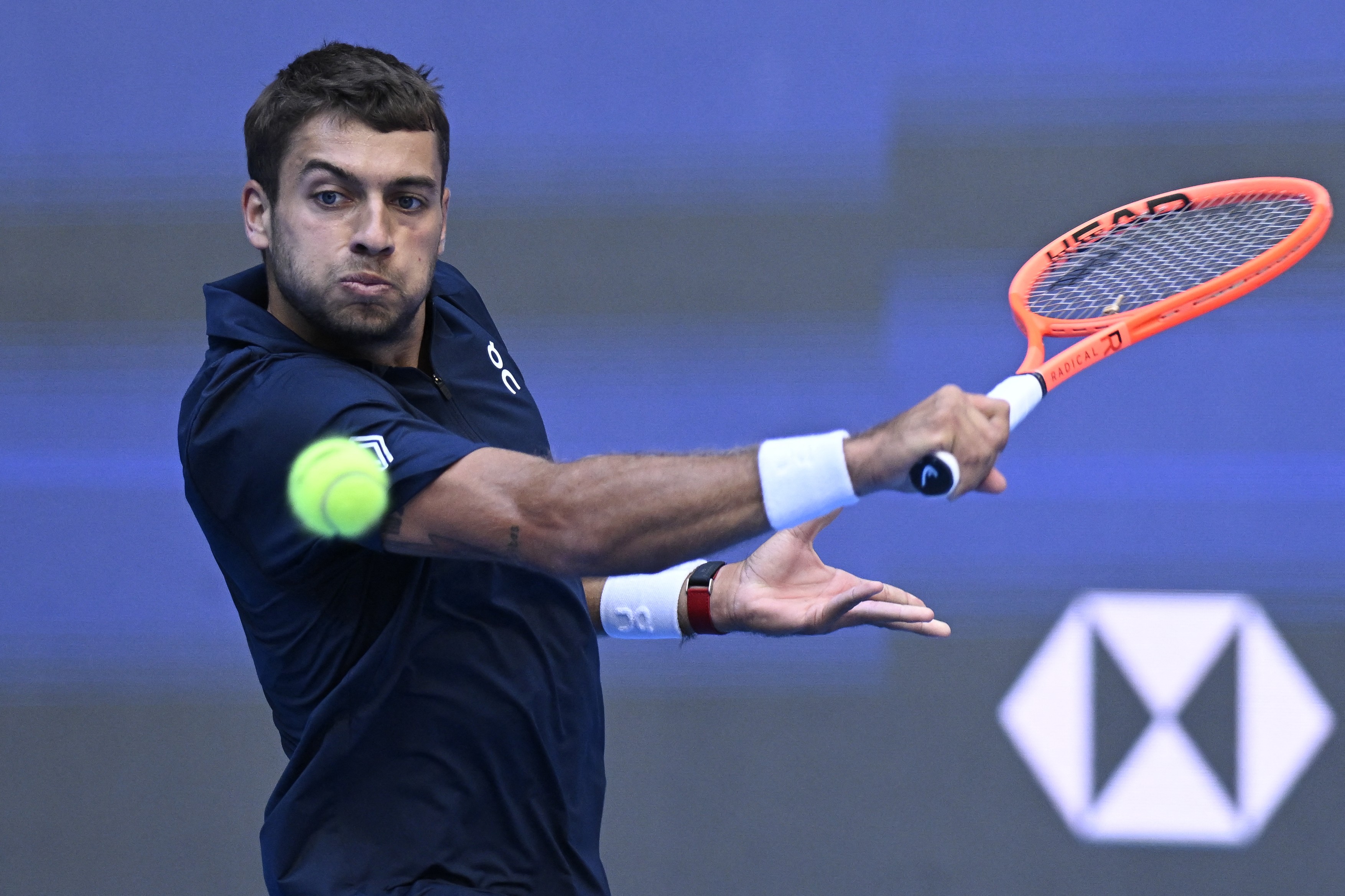 Italy's Flavio Cobolli hits a return to Russia’s Roman Safiullin