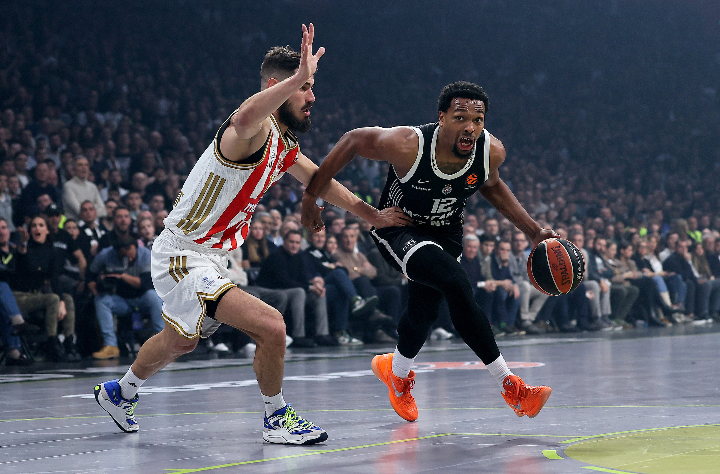 Nikola Kalinic of Crvena Zvezda (L) in action against Sterling Brown of Partizan (R)