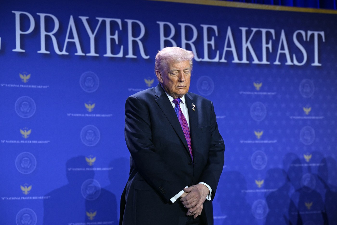 US President Donald Trump bows his head in prayer during the National Prayer Breakfast Model Release: no, Credit line: SAUL LOEB / AFP / Profimedia
