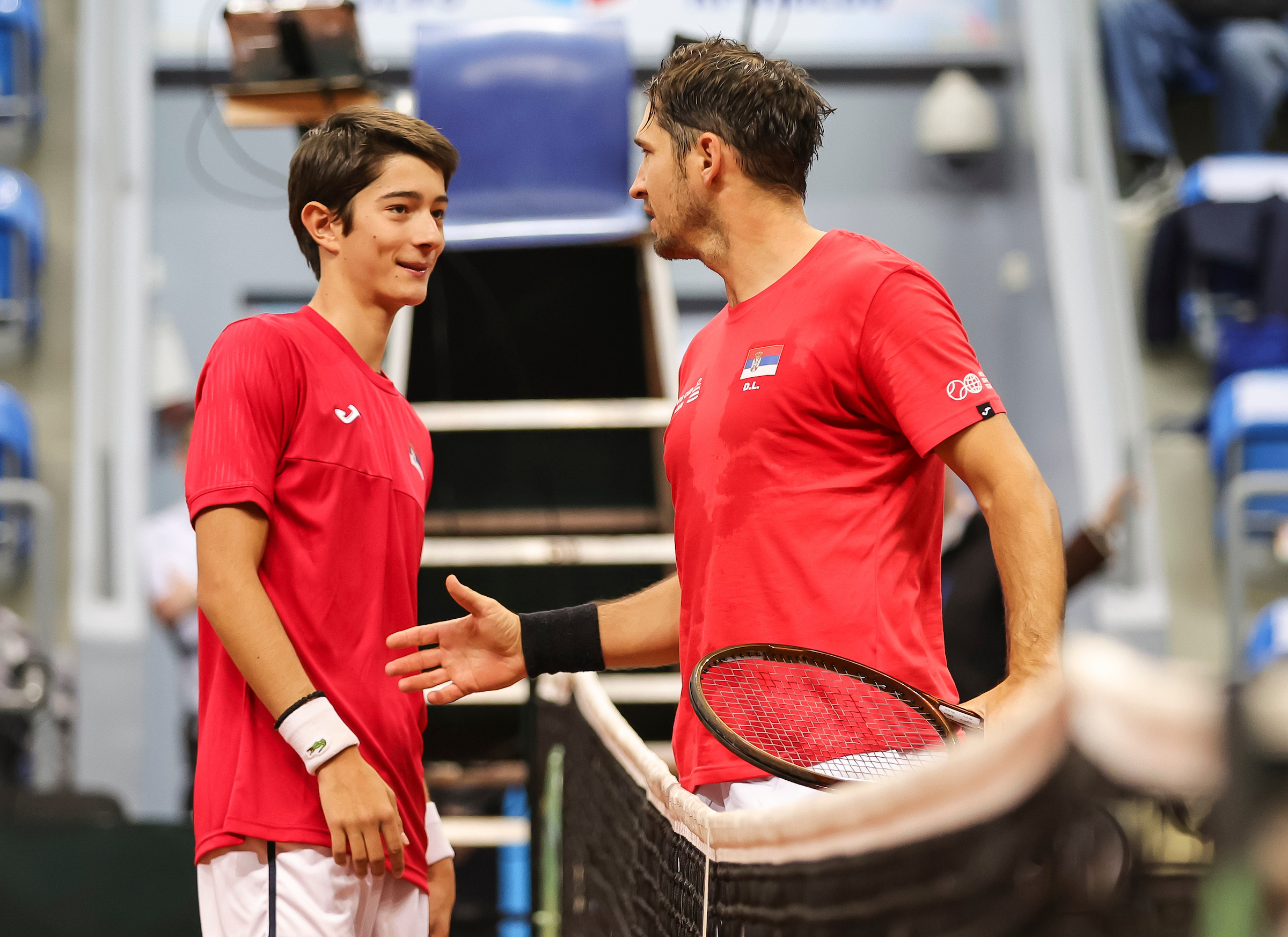 Ognjen Milic shake hands with Dusan Lajovic of Serbia during the 2023 Davis Cup Qualifiers between Serbia and Slovakia at Sportski centar Ibar, on February 02, 2024 in Kraljevo, Serbia. (Photo by Srdjan Stevanovic/Starsport.rs ©)