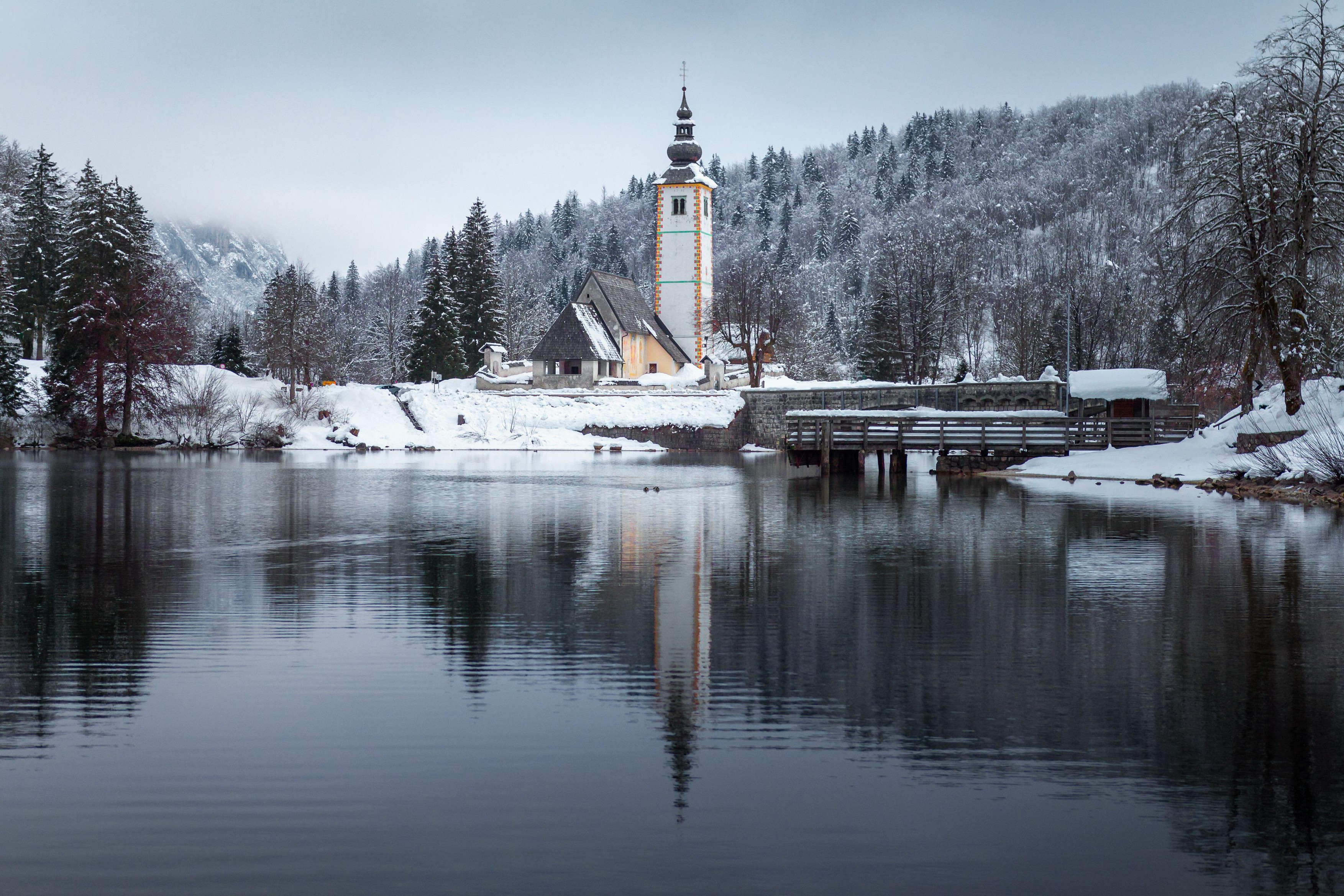 Old church at Lake Bohinj in winter snow, Slovenia,Image: 965954994, License: Royalty-free, Restrictions: , Model Release: no, Credit line: 24K-Production / Alamy / Profimedia