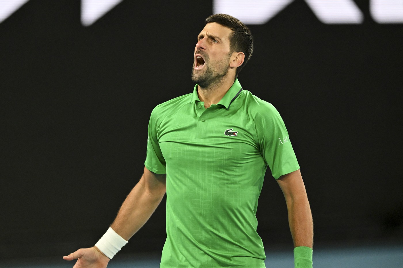 Carlos Alcaraz of Spain compete against Novak Djokovic of