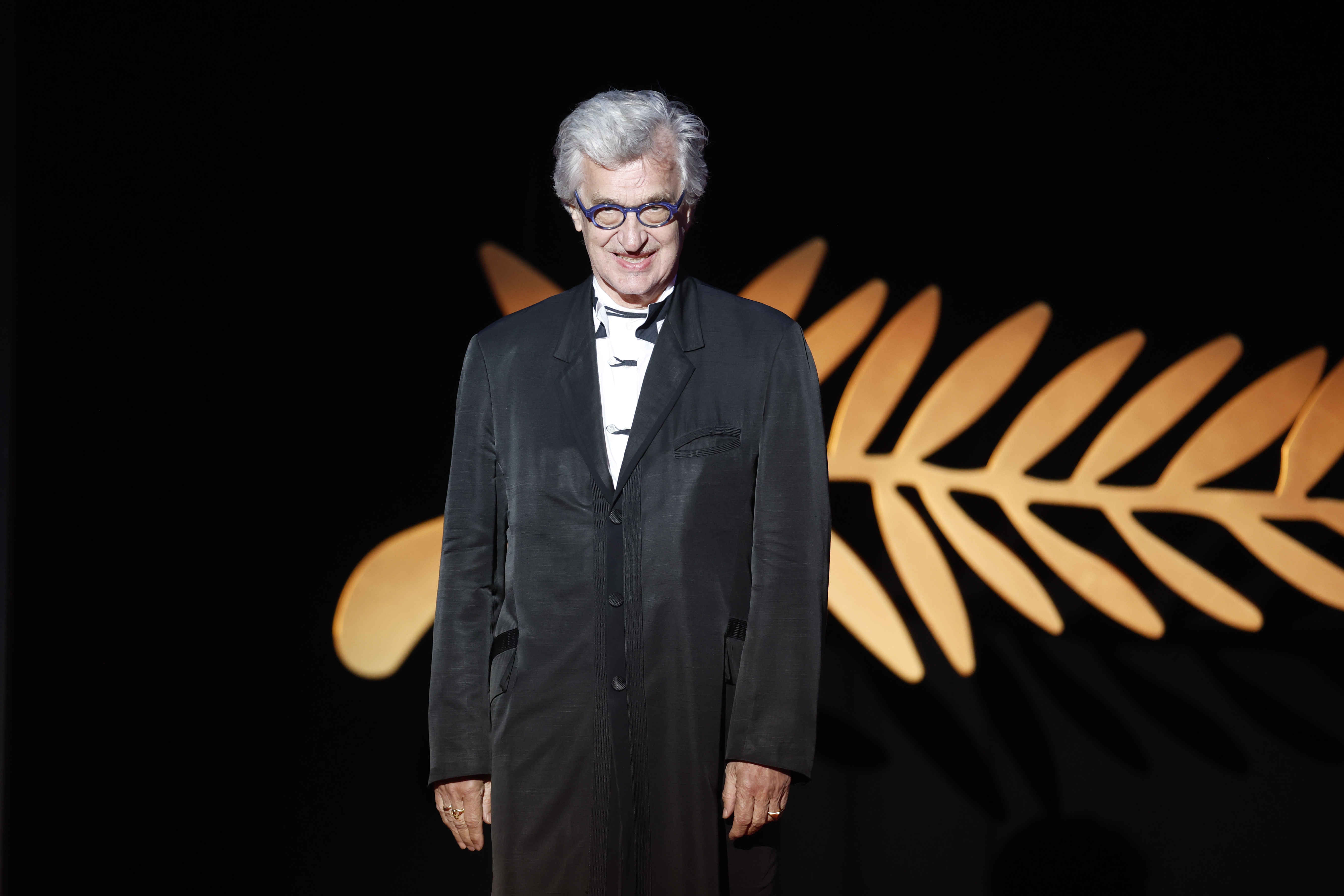 epa11369873 Wim Wenders appears onstage during the closing and awards ceremony of the 77th annual Cannes Film Festival, in Cannes, France, 25 May 2024. The film festival runs from 14 to 25 May 2024.  EPA/SEBASTIEN NOGIER