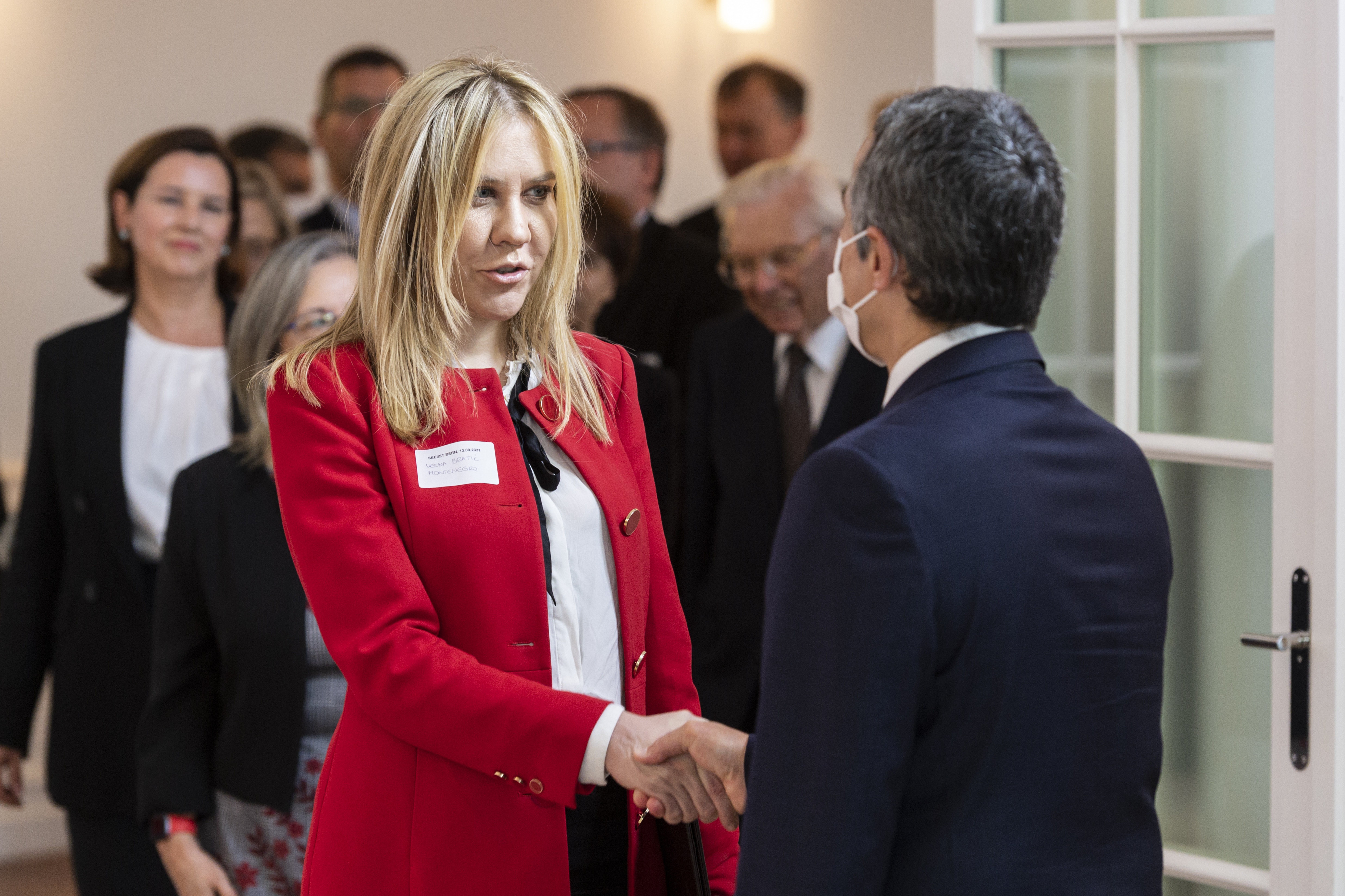 epa09466078 Federal Councillor Ignazio Cassis, right, welcomes Vesna Bratic,