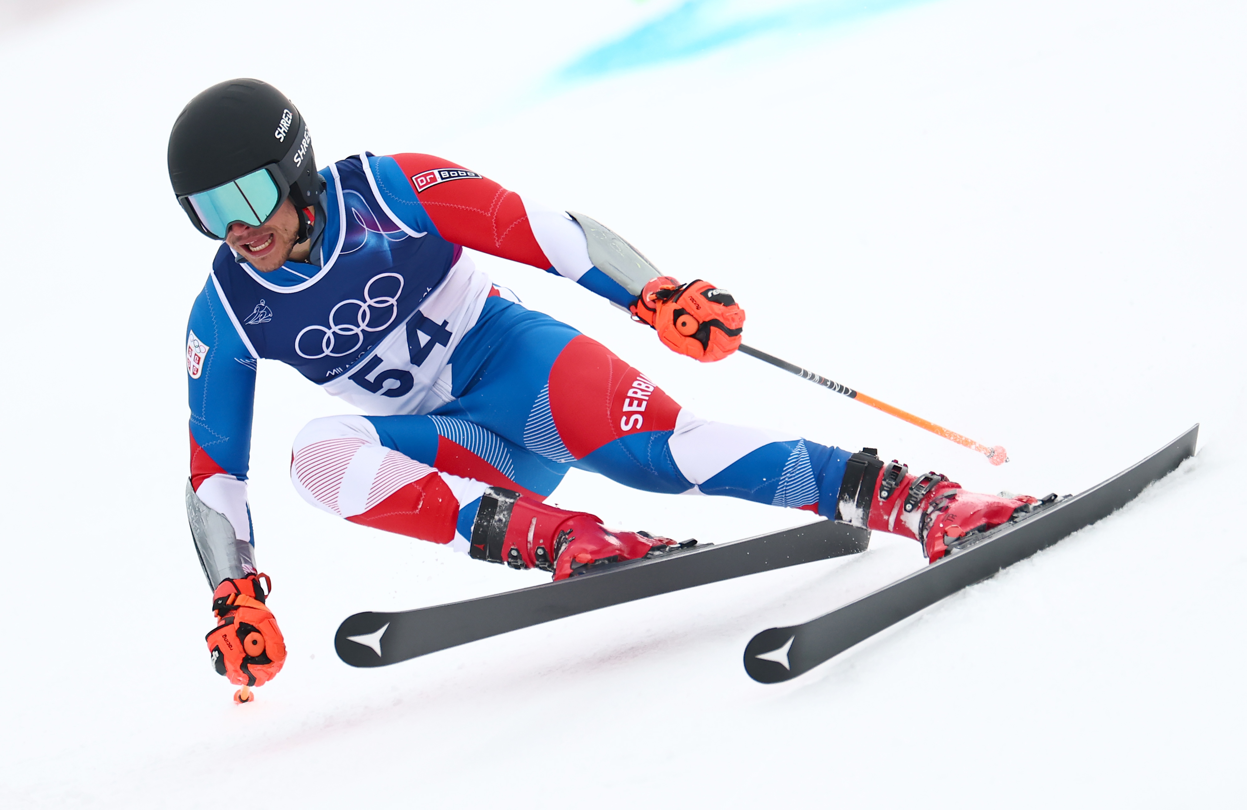Aleksa Tomovic of Serbia competes in the Men's Giant Slalom of the Alpine Skiing competitions at the Milano Cortina 2026 Winter Olympic Games