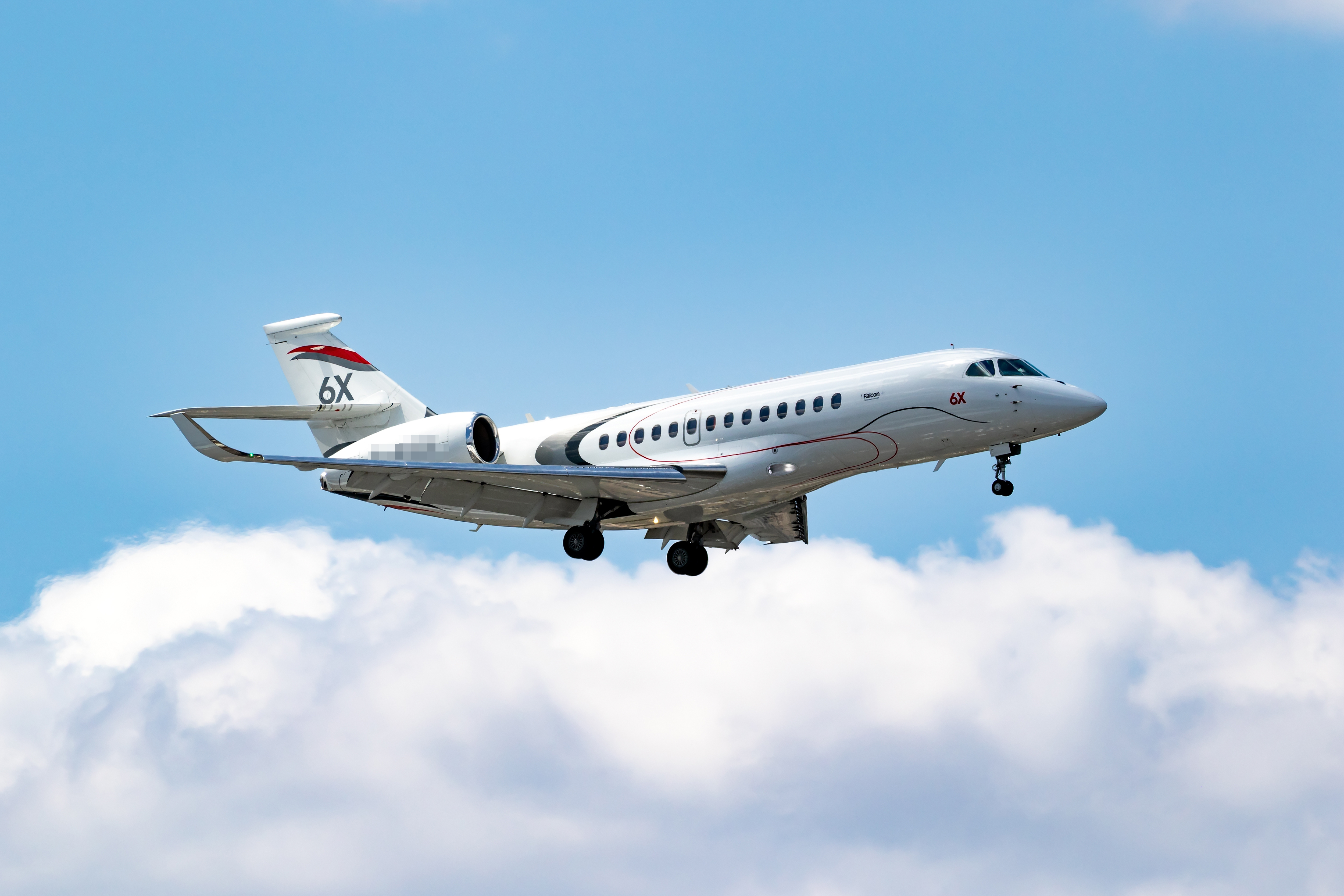 Dassault Falcon 6X corporate jet flying at the Paris Air Show. Le Bourget, France - June 16, 2025