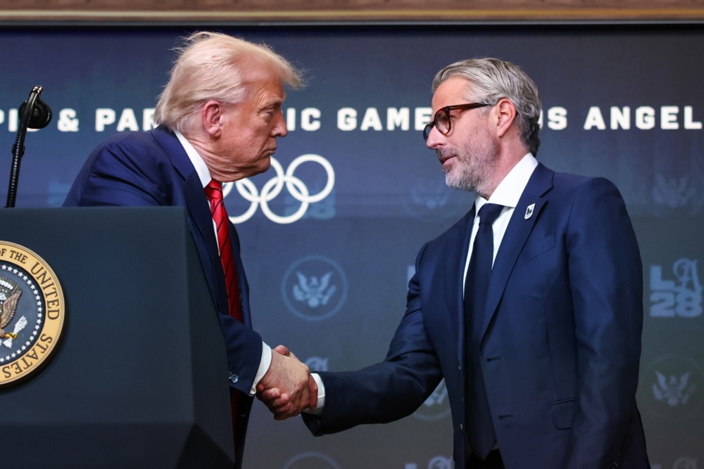 epa12285187 U.S. President Donald Trump shakes hands with Casey Wasserman,