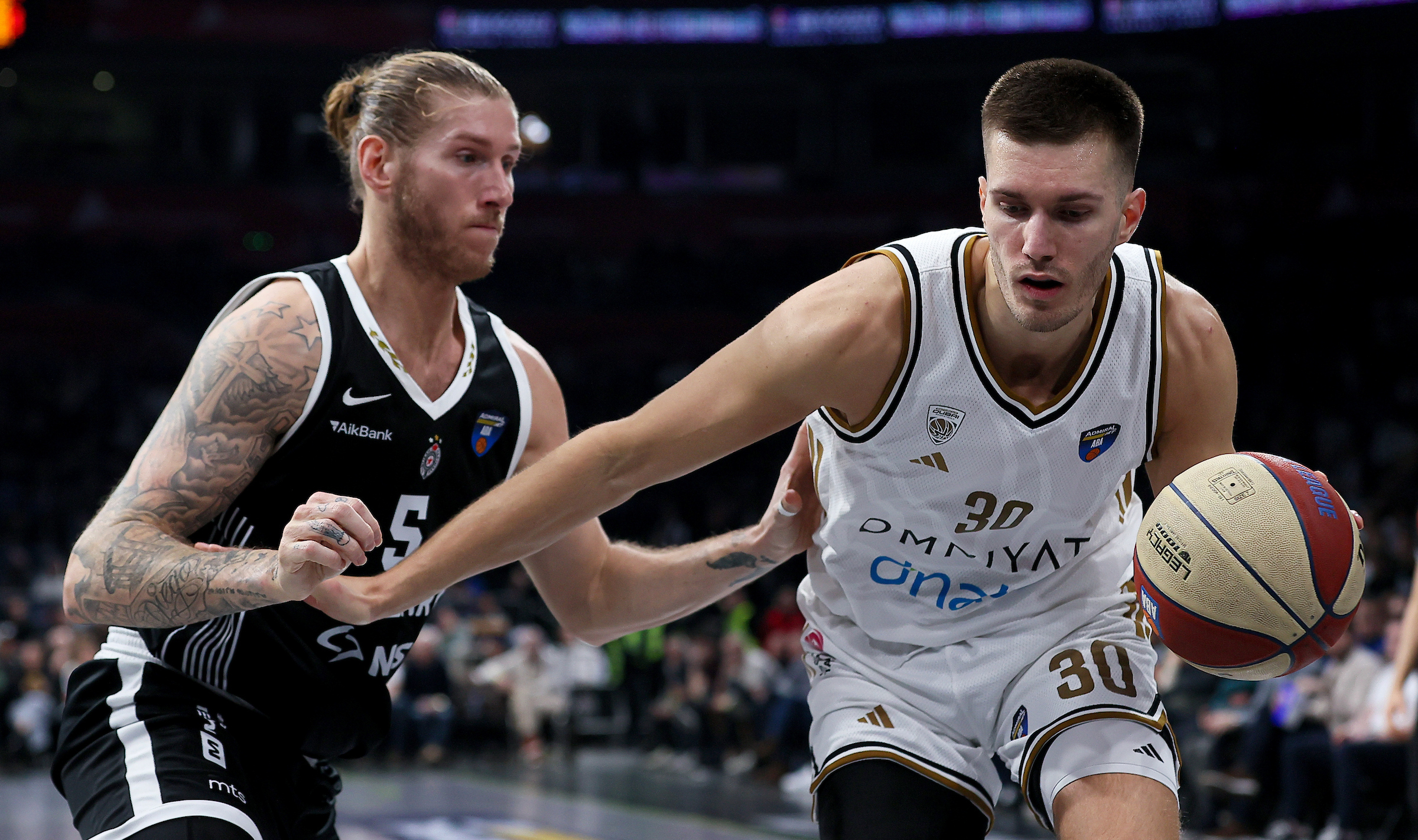 Dylan Osetkowski of Partizan (L) in action against Filip Petrusev Of Dubai (R)