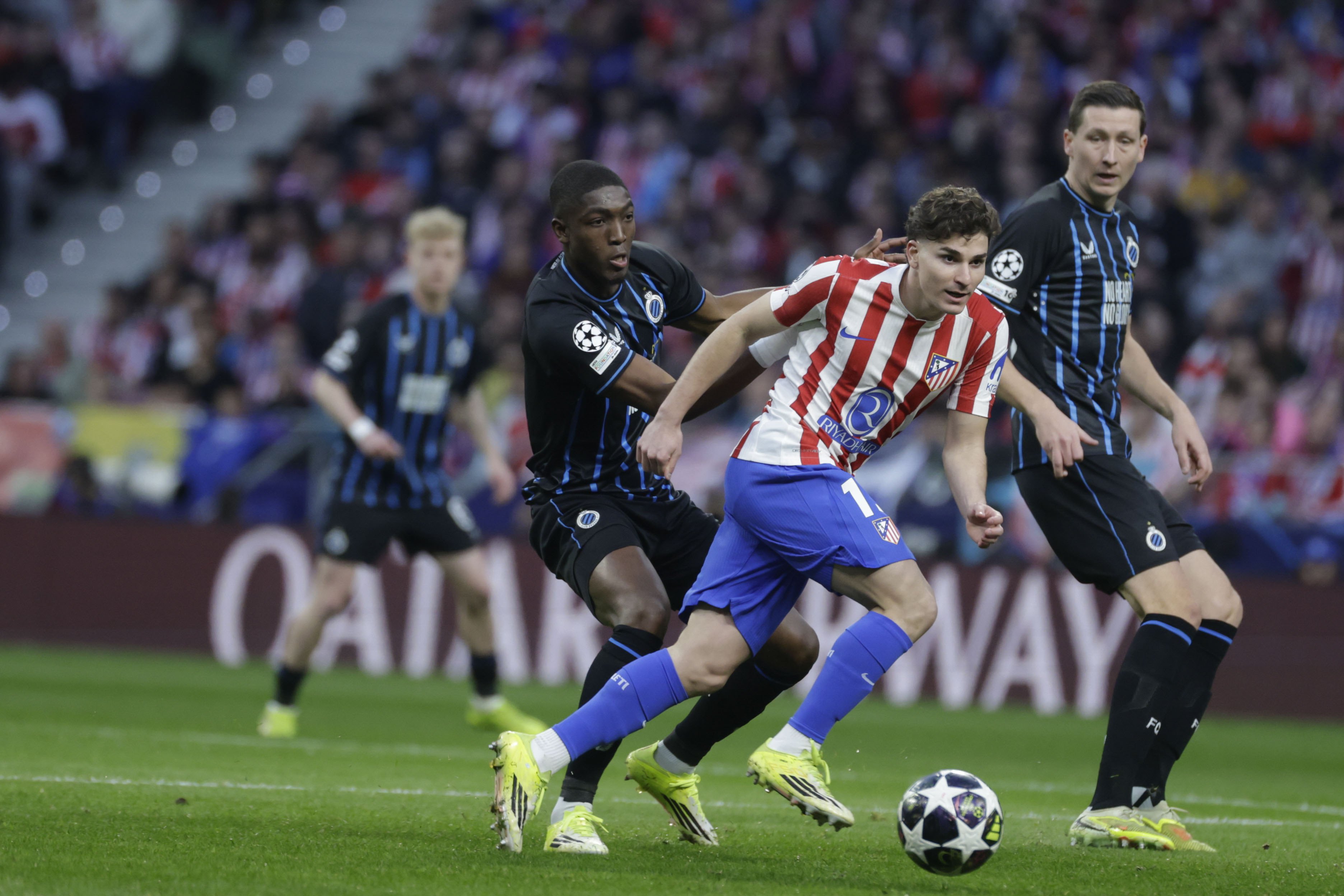 Atletico Madrid's Julian Alvarez (R) in action against Brugge's Carlos Forbs (L) at League Champions