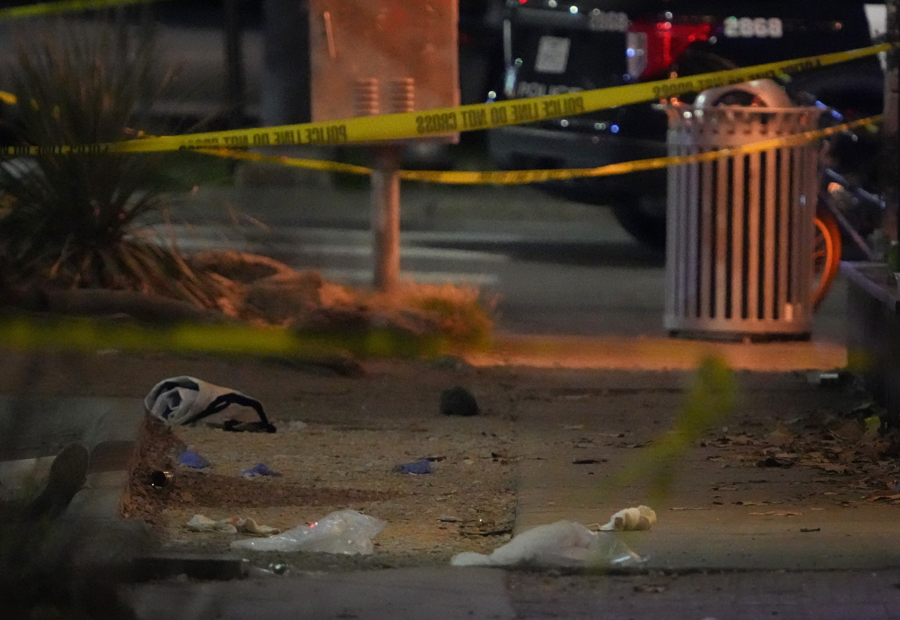 Debris litters the sidewalk at the scene on West Sixth Street after a shooting outside Buford's bar in downtown Austin, Sunday, March 1, 2026. (Jay Janner/Austin American-Statesman via AP)