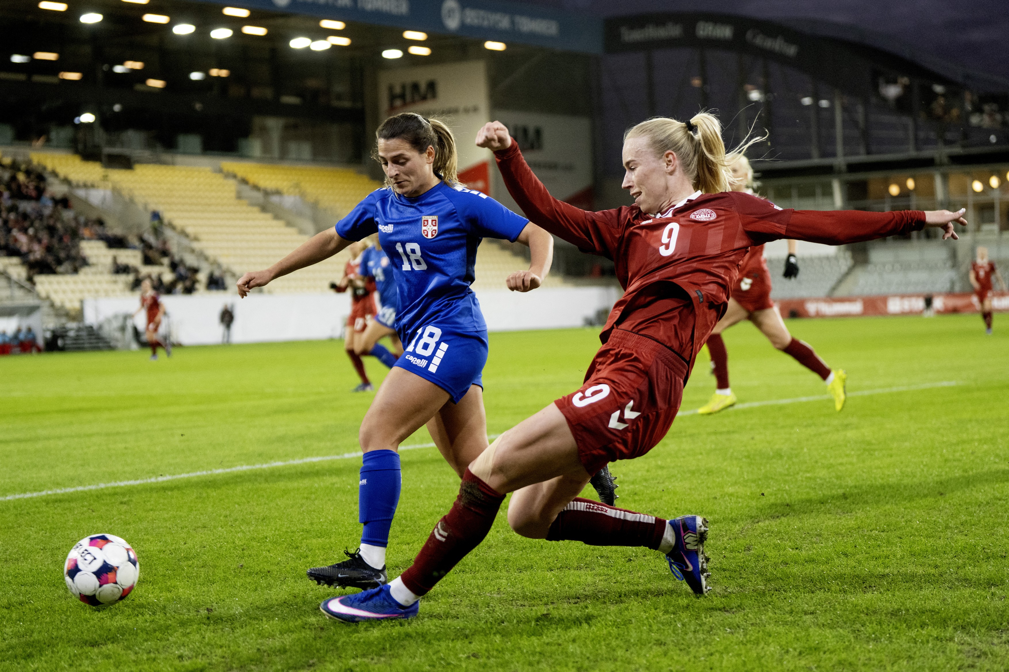 Denmark's Amalie Vangsgaard in action with Serbia's Emma Petrovic during the Women's World Cup qualification match between Denmark and Serbia at Horsens Stadium on Tuesday, March 3, 2026.