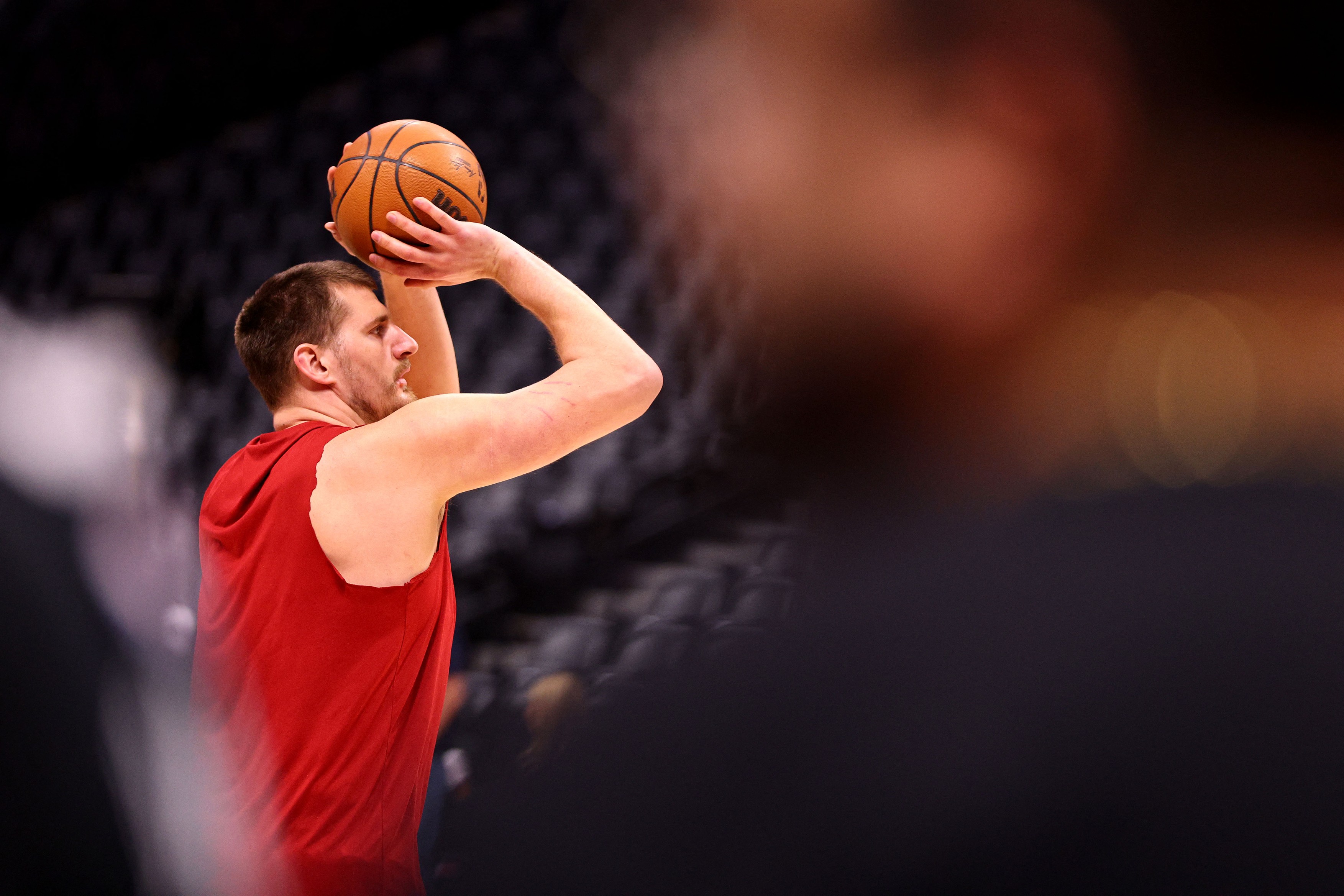 DENVER, COLORADO - FEBRUARY 25: Nikola Jokic #15 of the Denver Nuggets warms up for the NBA game