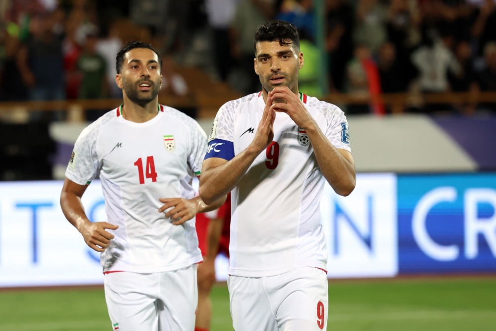 epa12168547 Mehdi Tarmi (R) of Iran celebrates after scoring the 2-0
