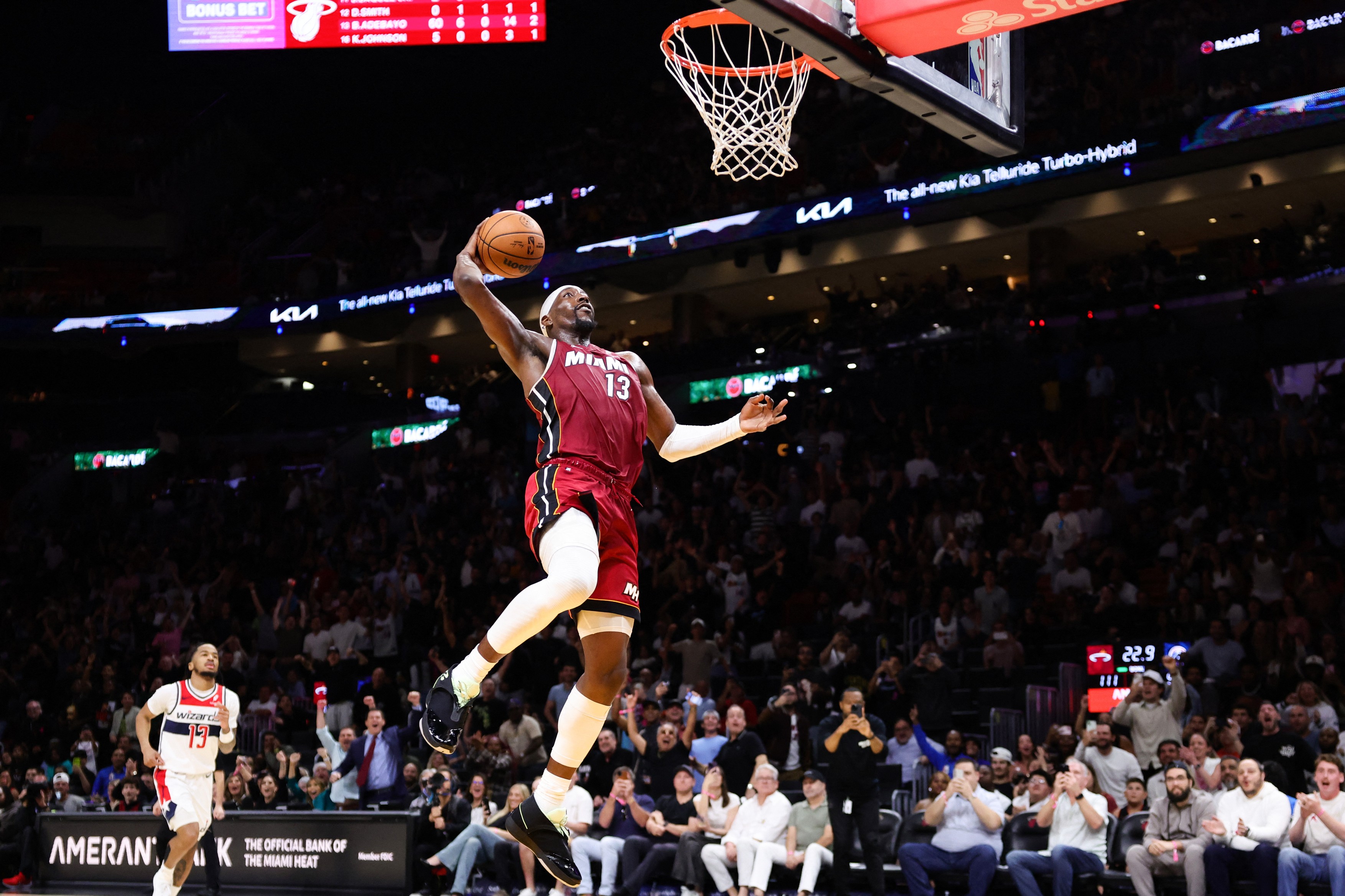 MIAMI, FLORIDA - MARCH 10: Bam Adebayo #13 of the Miami Heat dunks the ball against the Washington Wizards