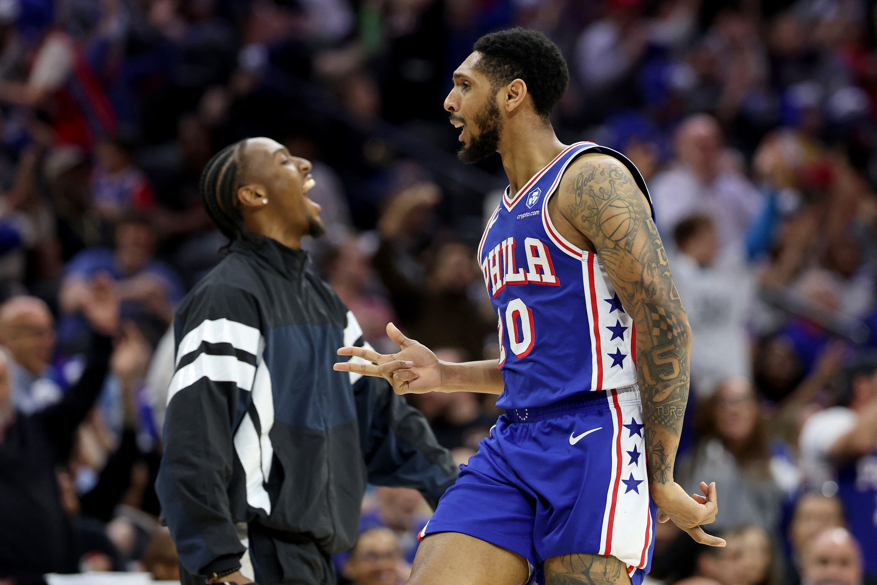 PHILADELPHIA, PENNSYLVANIA - MARCH 10: Cameron Payne #20 of the Philadelphia 76ers celebrates a three-pointer with Tyrese Maxey #0 during the second half against the Memphis Grizzlies at Xfinity Mobile Arena