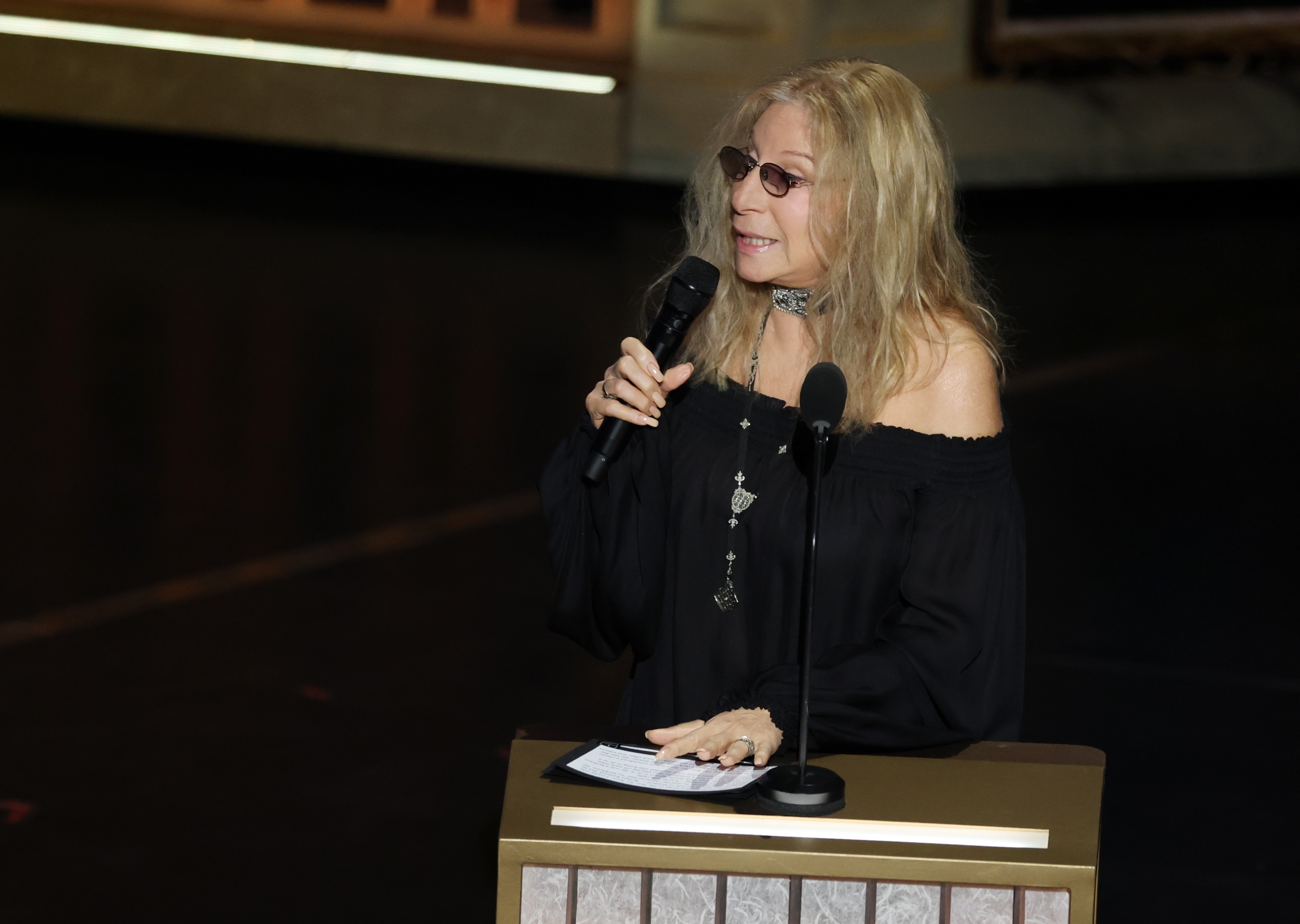 Barbra Streisand pays tribute to Rob Reiner and his wife Michele on stage during