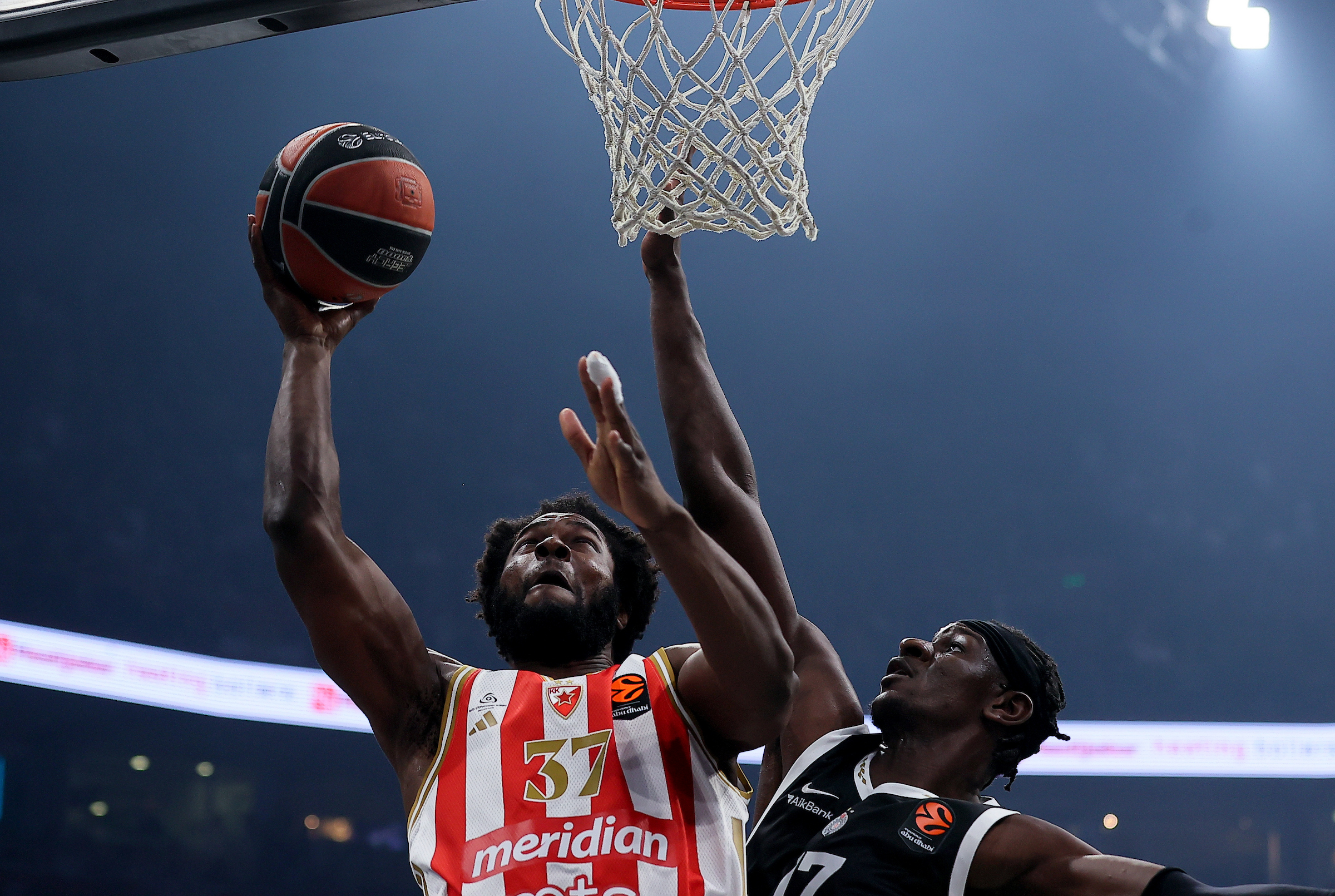 Semi Ojeleye of Crvena Zvezda (L) in action against Isaac Bonga of Partizan (R)
