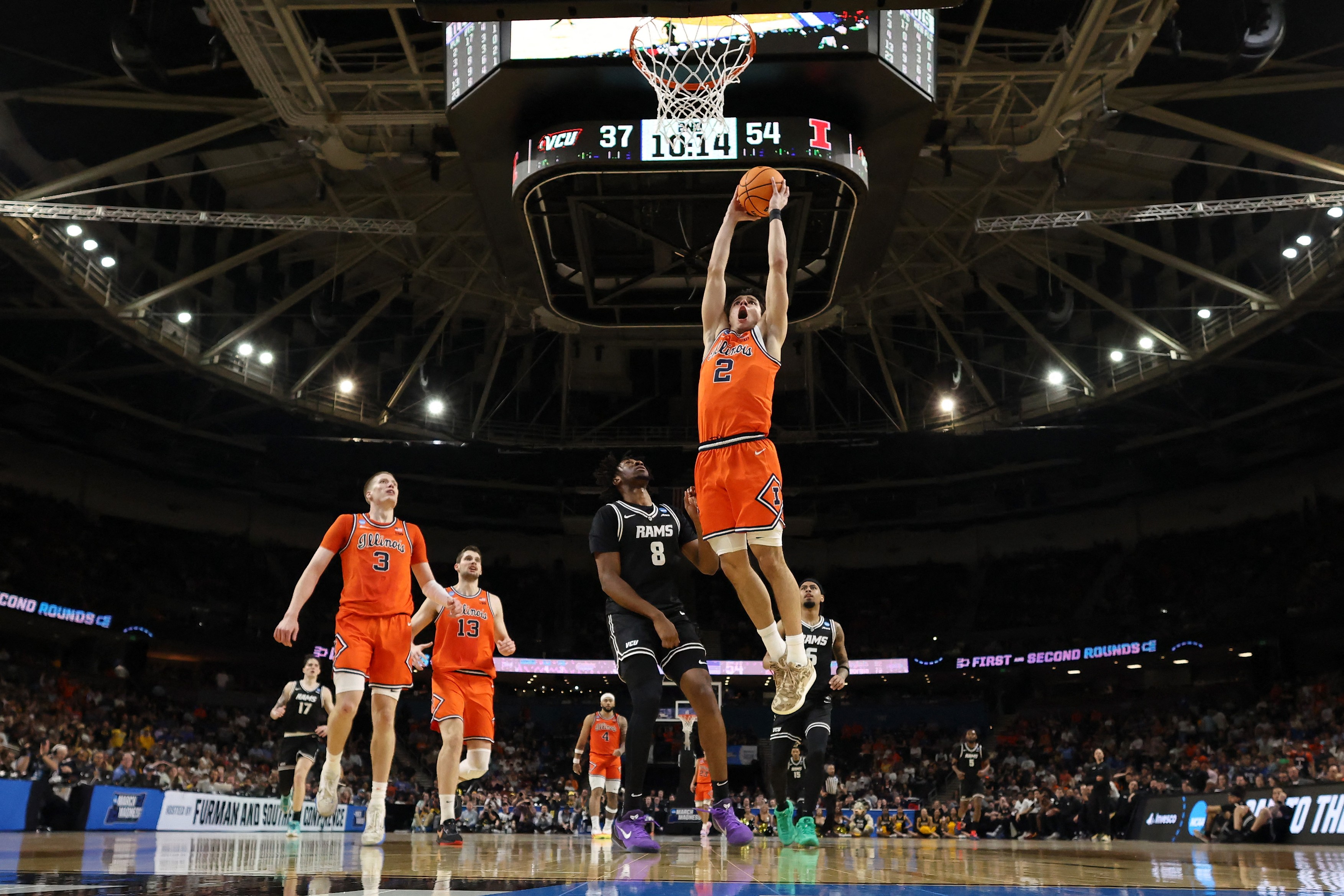 Andrej Stojakovic #2 of the Illinois Fighting Illini dunks the ball against Michael Belle #8 of the VCU Rams during the second half in the second round of the 2026 NCAA Men's Basketball Tournament at Bon Secours Wellness Arena