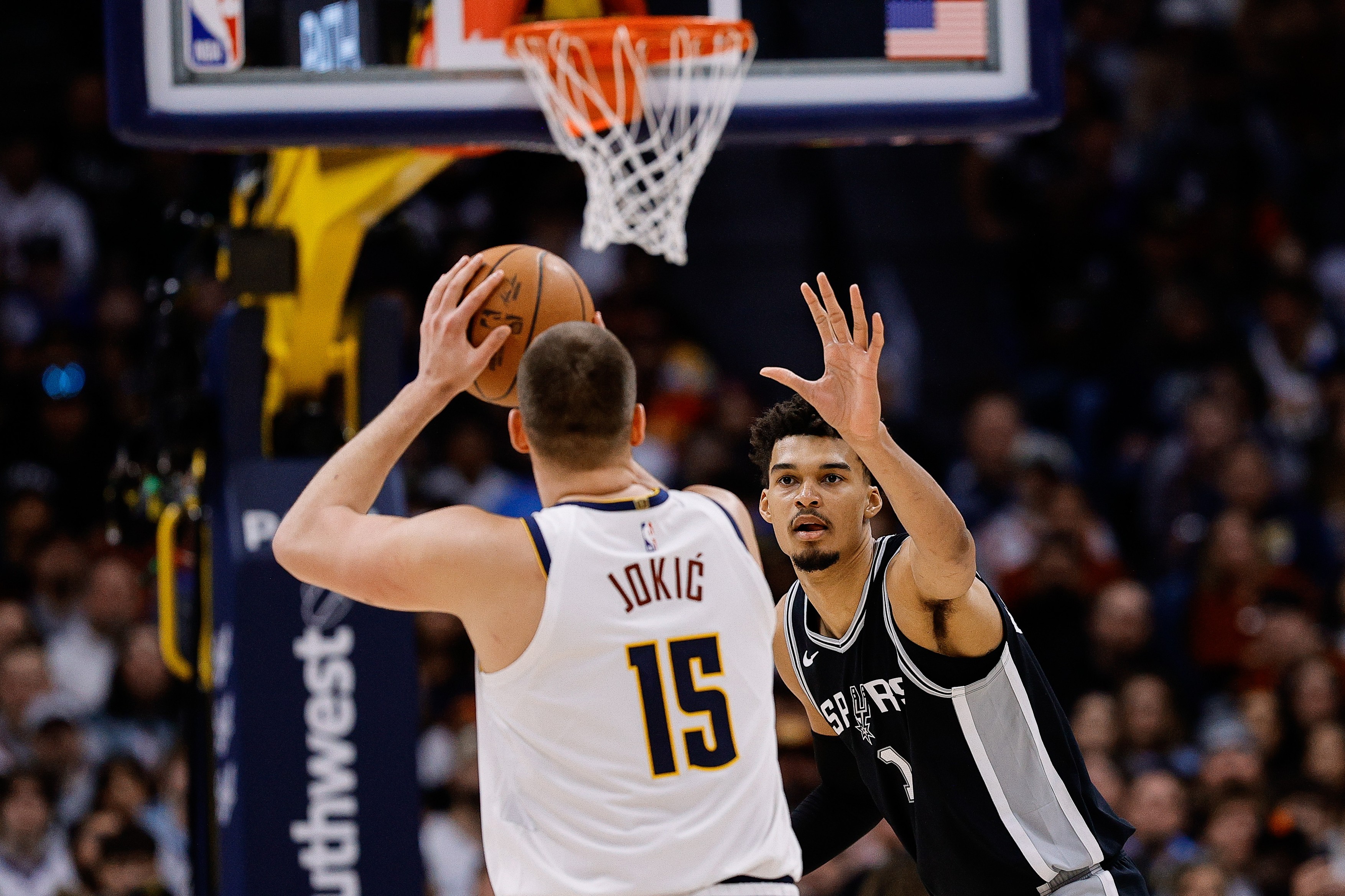 Denver Nuggets center Nikola Jokic (15) attempts a shot against San Antonio Spurs center Victor Wembanyama (1)