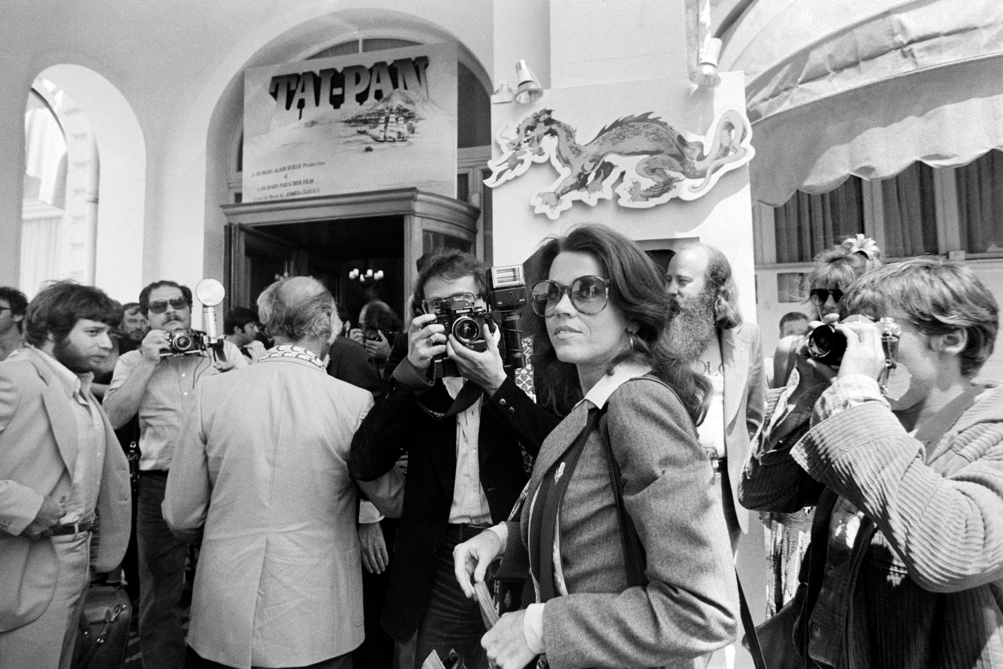 Us actress Jane Fonda (C), surrounded by photographers, arrives at Carlton Hote