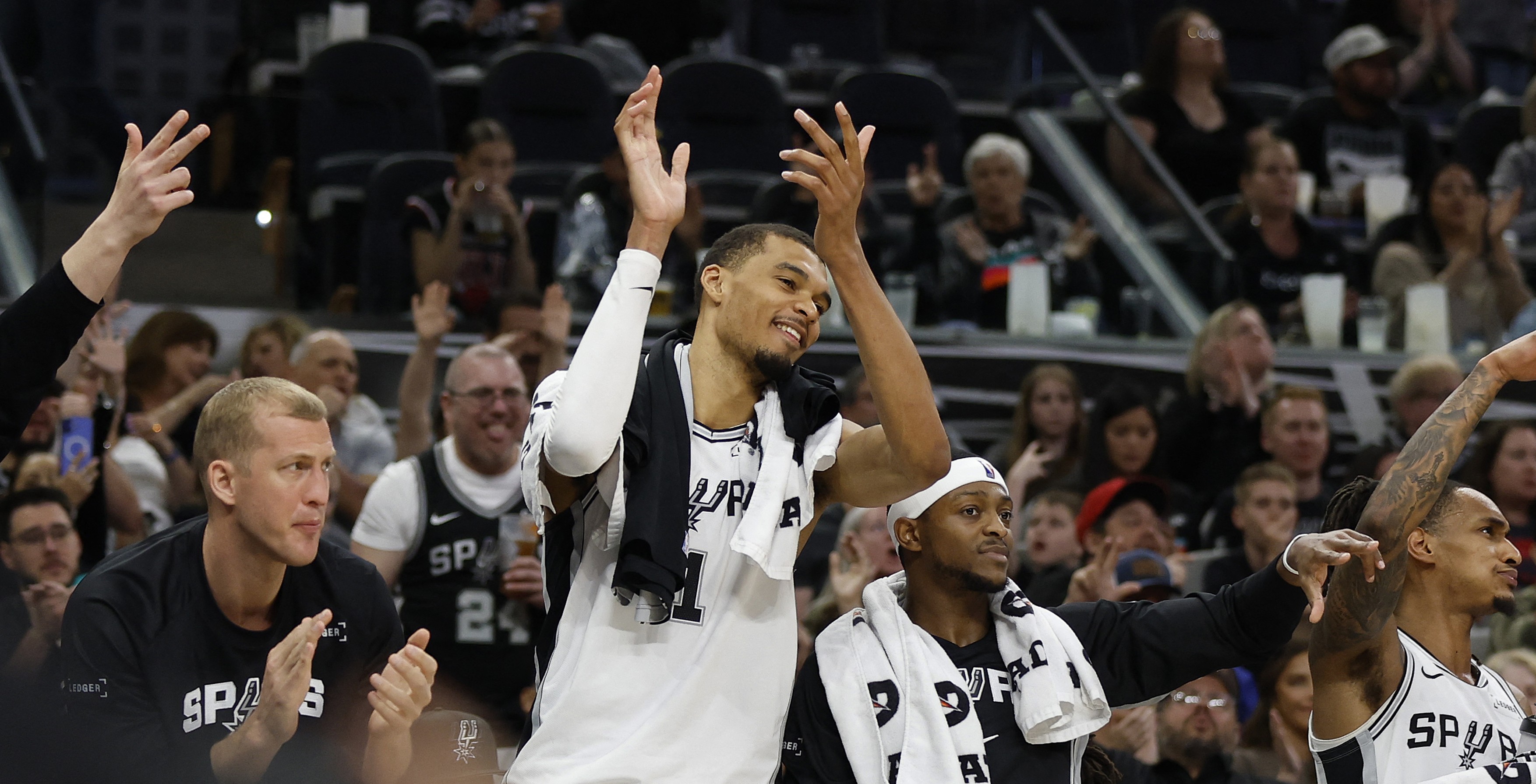 Victor Wembanyama #1 of the San Antonio Spurs cheers for the reserves