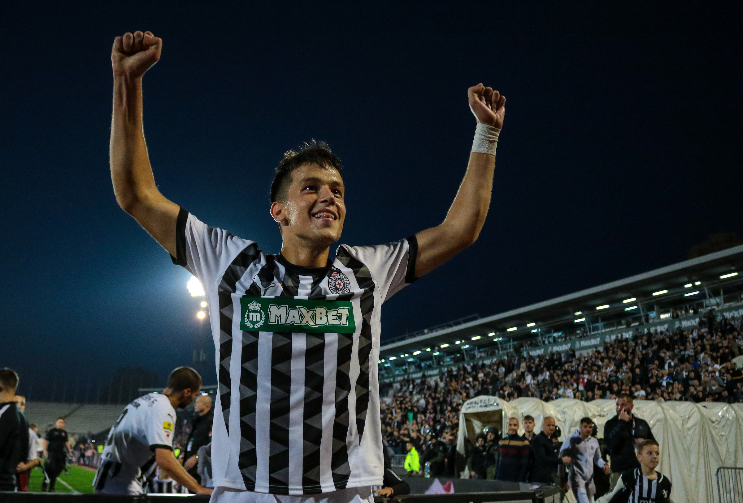 Mihajlo Ilic of Partizan celebrates wi