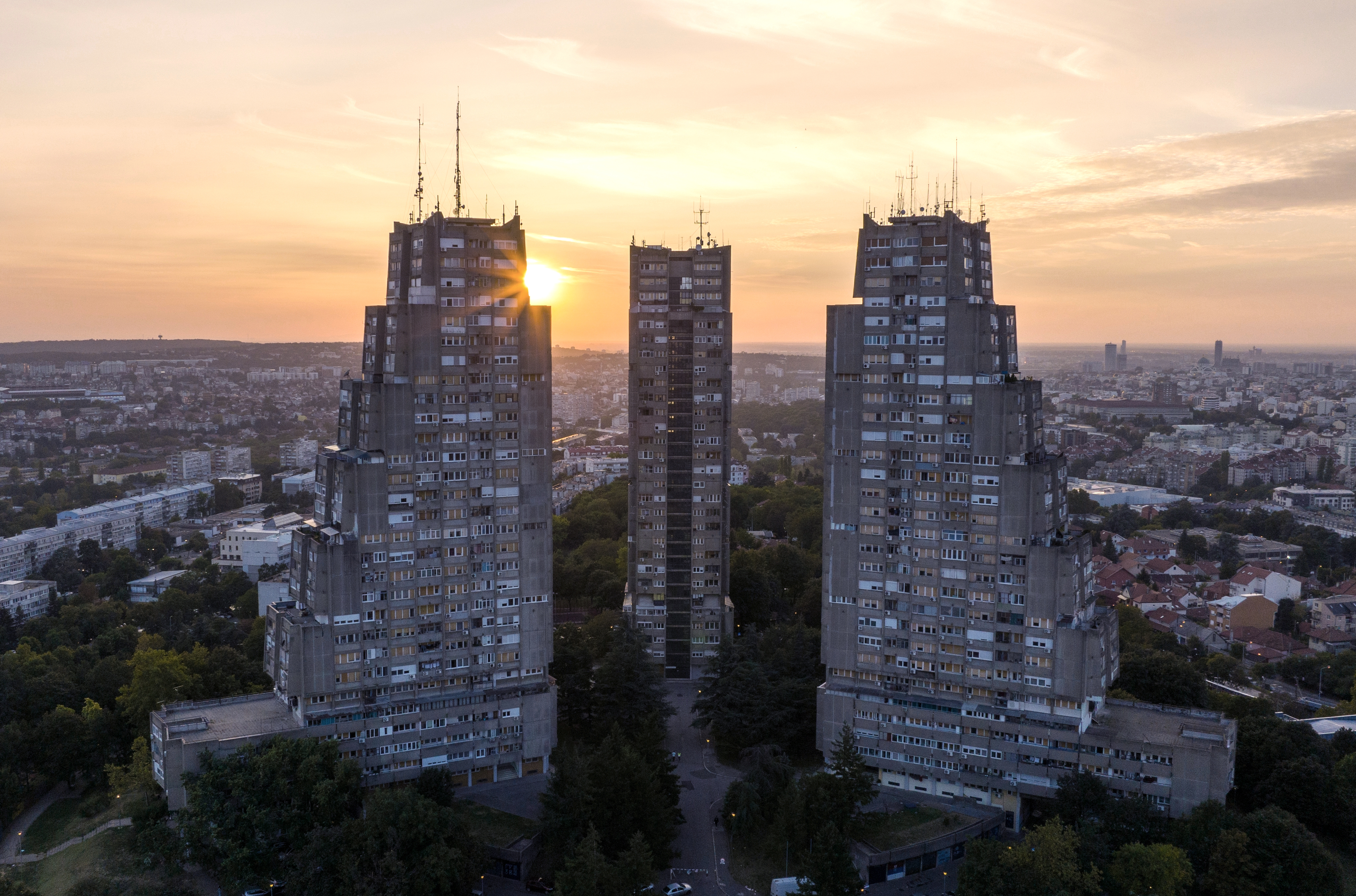East gate of Belgrade, Silhouette of Brutalist Condominium complex at sunset. Aerial of unique Architecture in Serbia