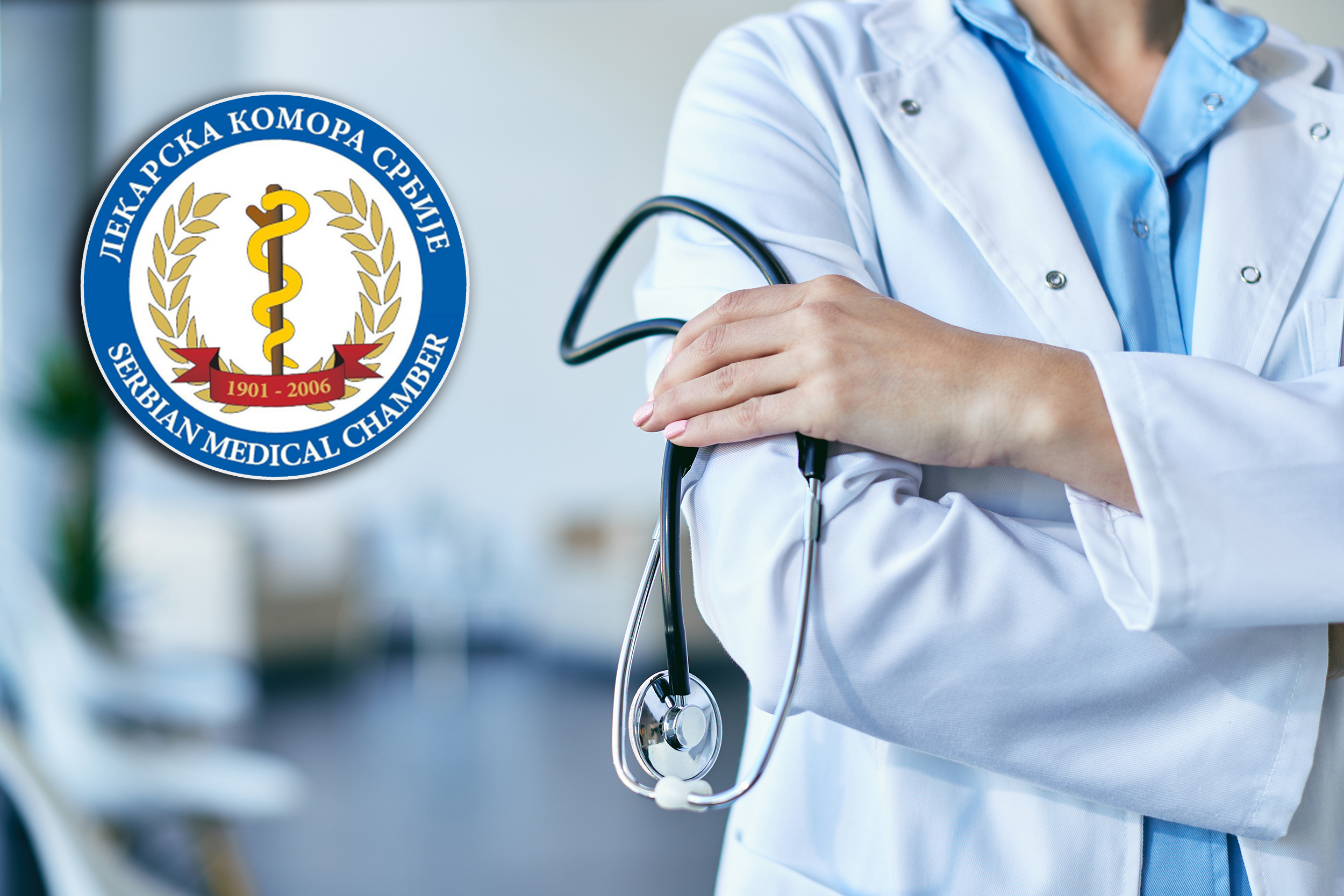 Close-up of unrecognizable doctor holding stethoscope while standing with arms crossed at medical clinic.