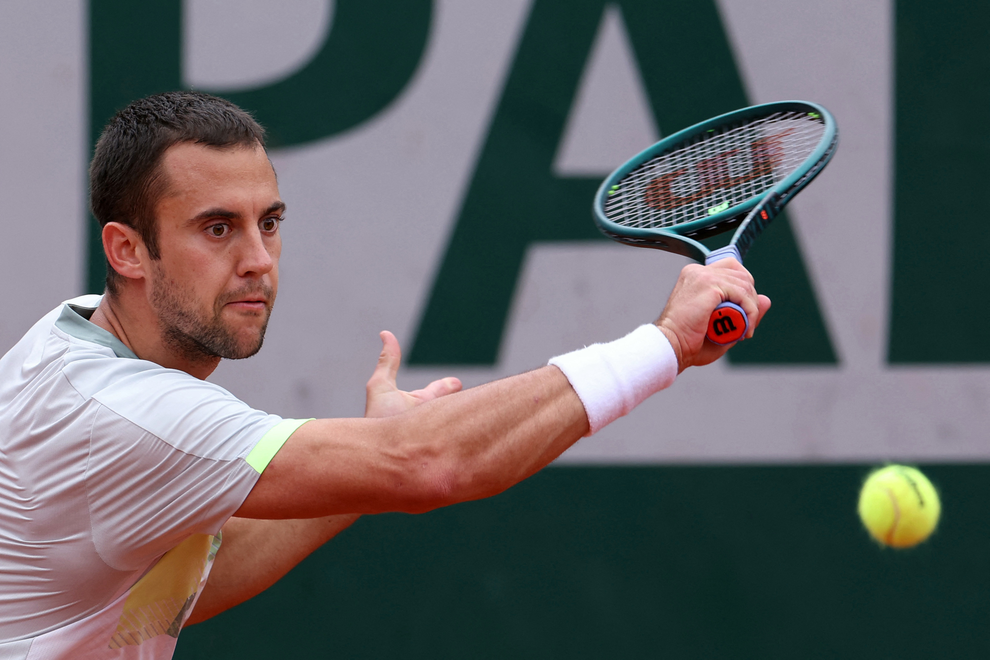 Serbia's Laslo Djere plays a backhand