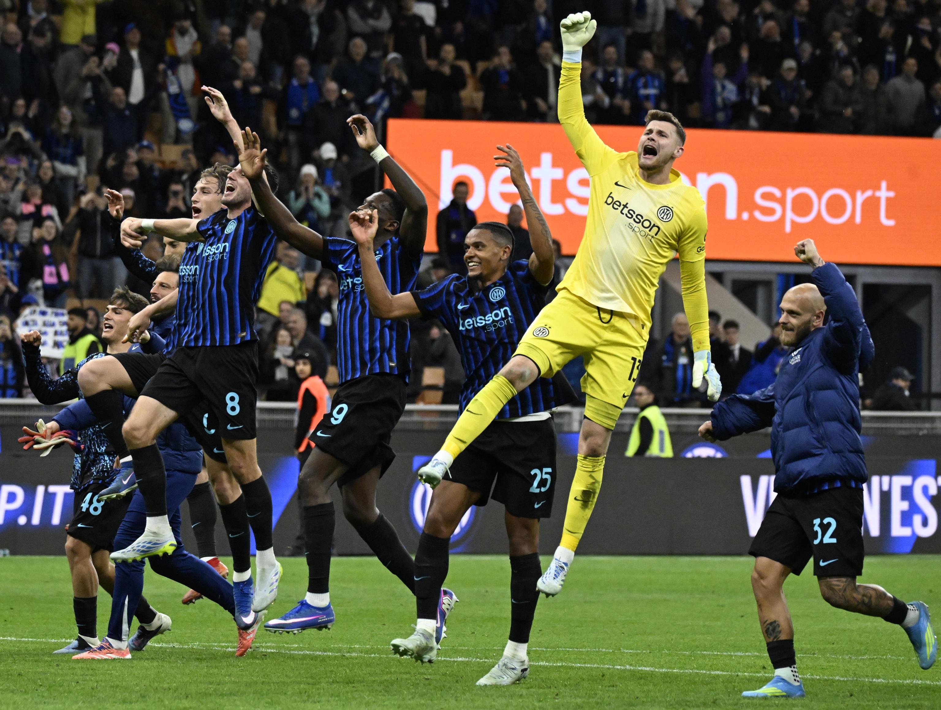 Inter Milan's players celebrate at the end of the Italian Coppa Italia cup semi-finals 2nd leg match against Como 1907