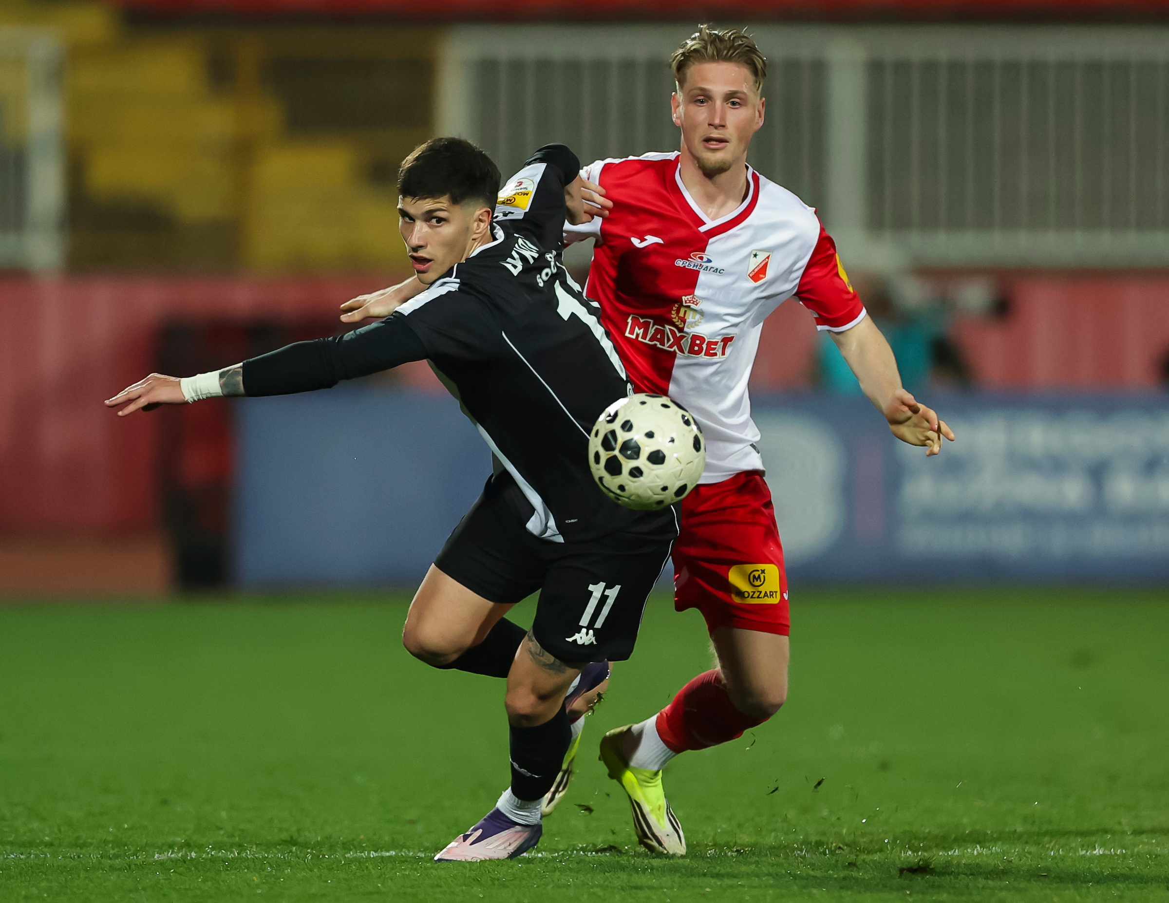 Milan Vukotic (L) of Partizan in action against Kornel Szucs of Vojvodina