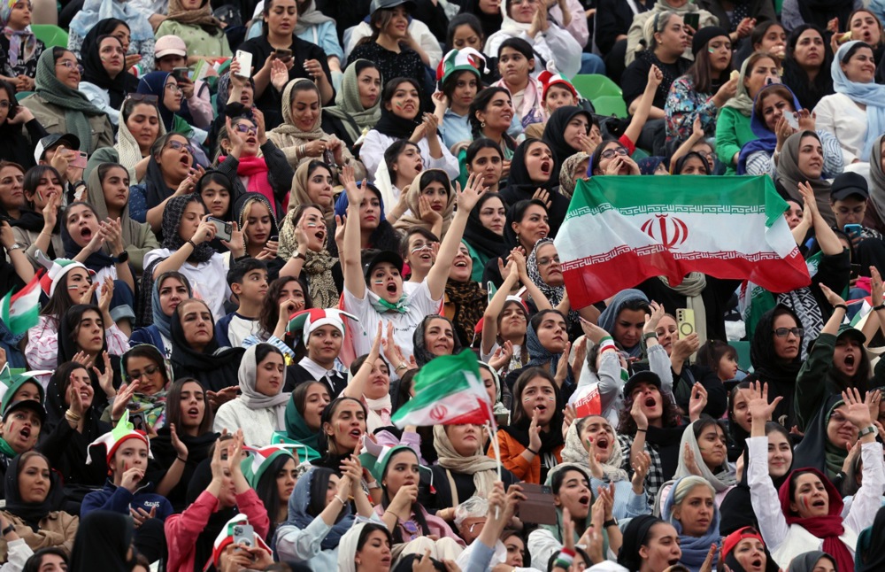 epa12168809 Female supporters of Iran cheer during the FIF