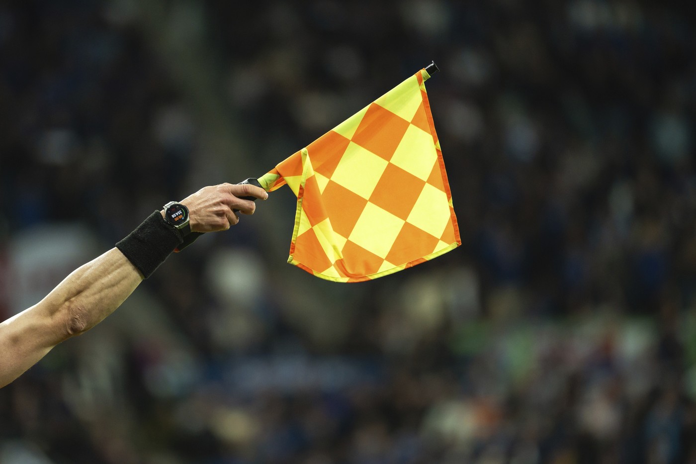 Raised flag in the hand of soccer sideline referee during football match in Wroclaw, Poland,Image: 1077791314, License: Royalty-free, Restrictions: , Model Release: no, Credit line: Piotr Dziurman / imageBROKER / Profimedia