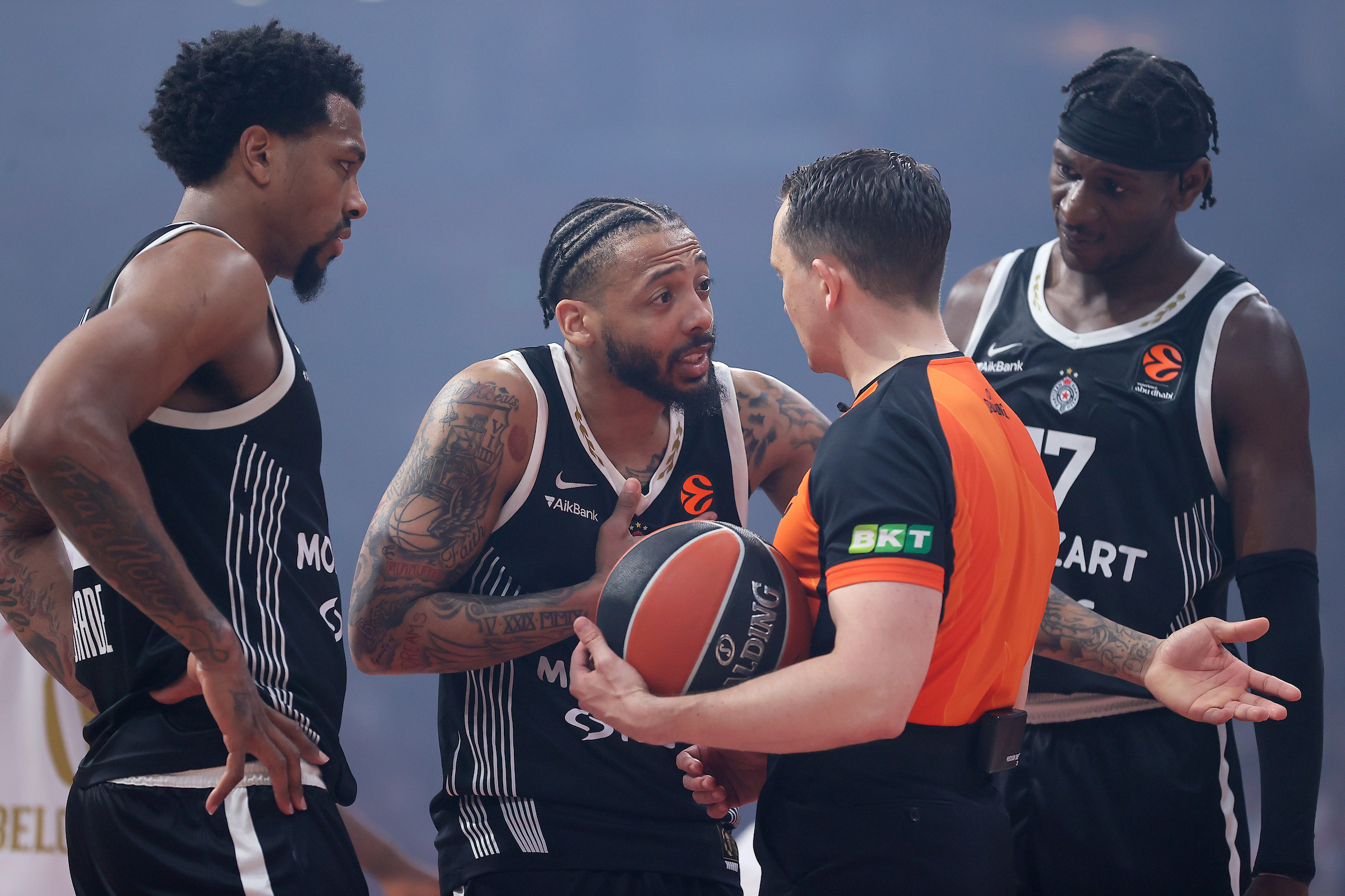 (L-R) Sterling Brown of Partizan, Carlik Jones of Partizan and Isaac