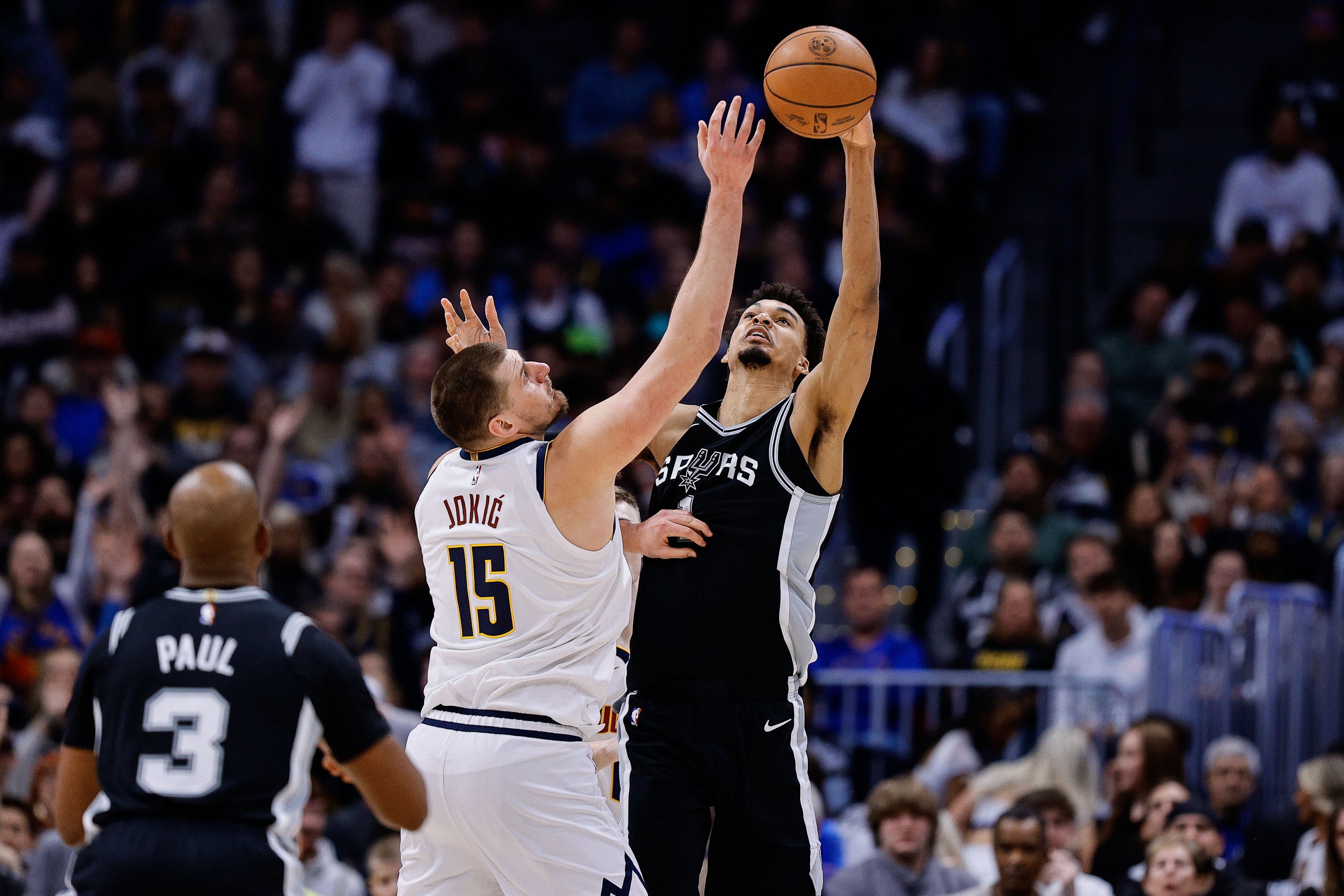Denver, Colorado, USA; Denver Nuggets center Nikola Jokic (15) and San Antonio Spurs center Victor Wembanyama (1)