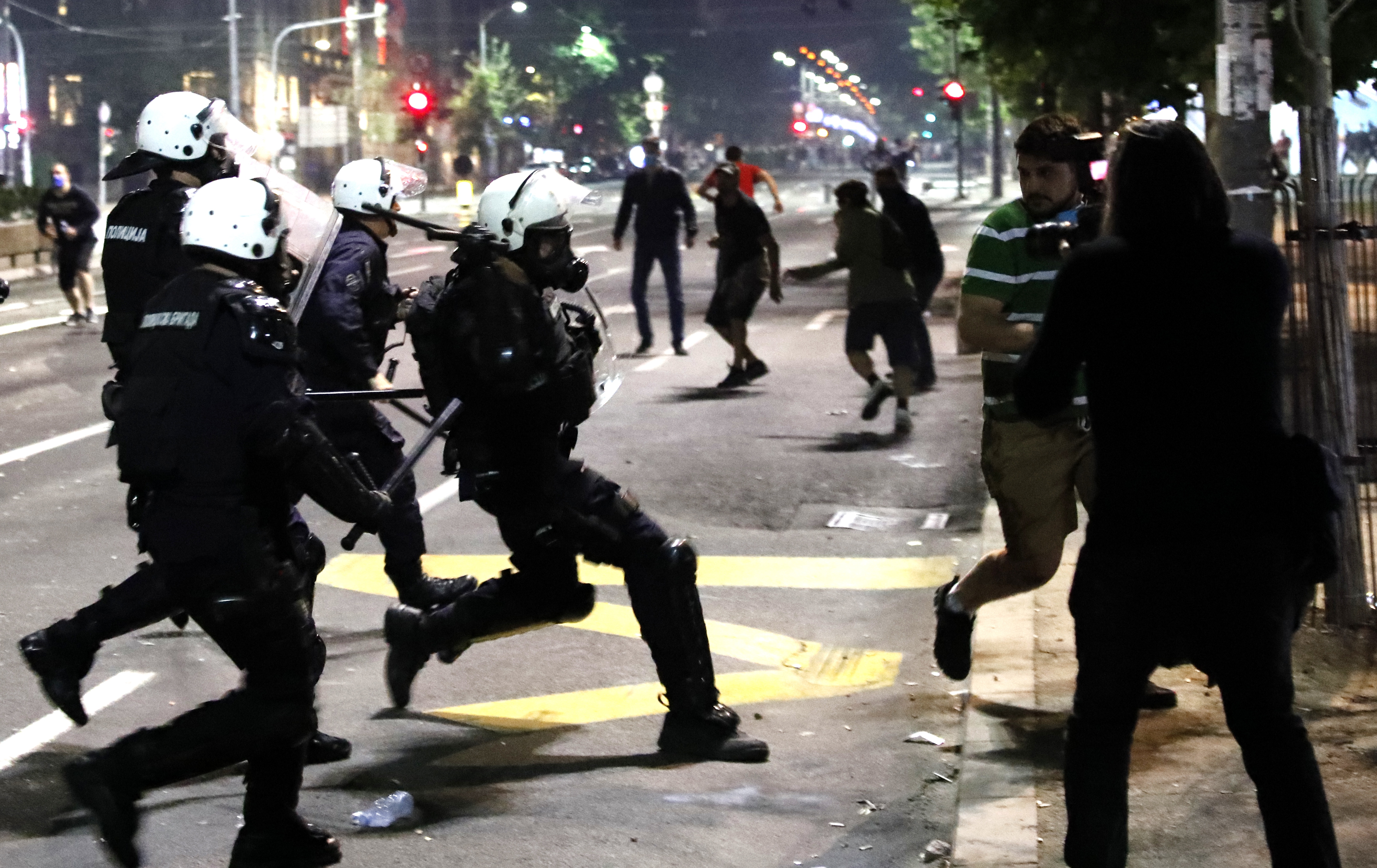 Police clash with protesters outside the Serbian Parliament building in Belgrade, Serbia,