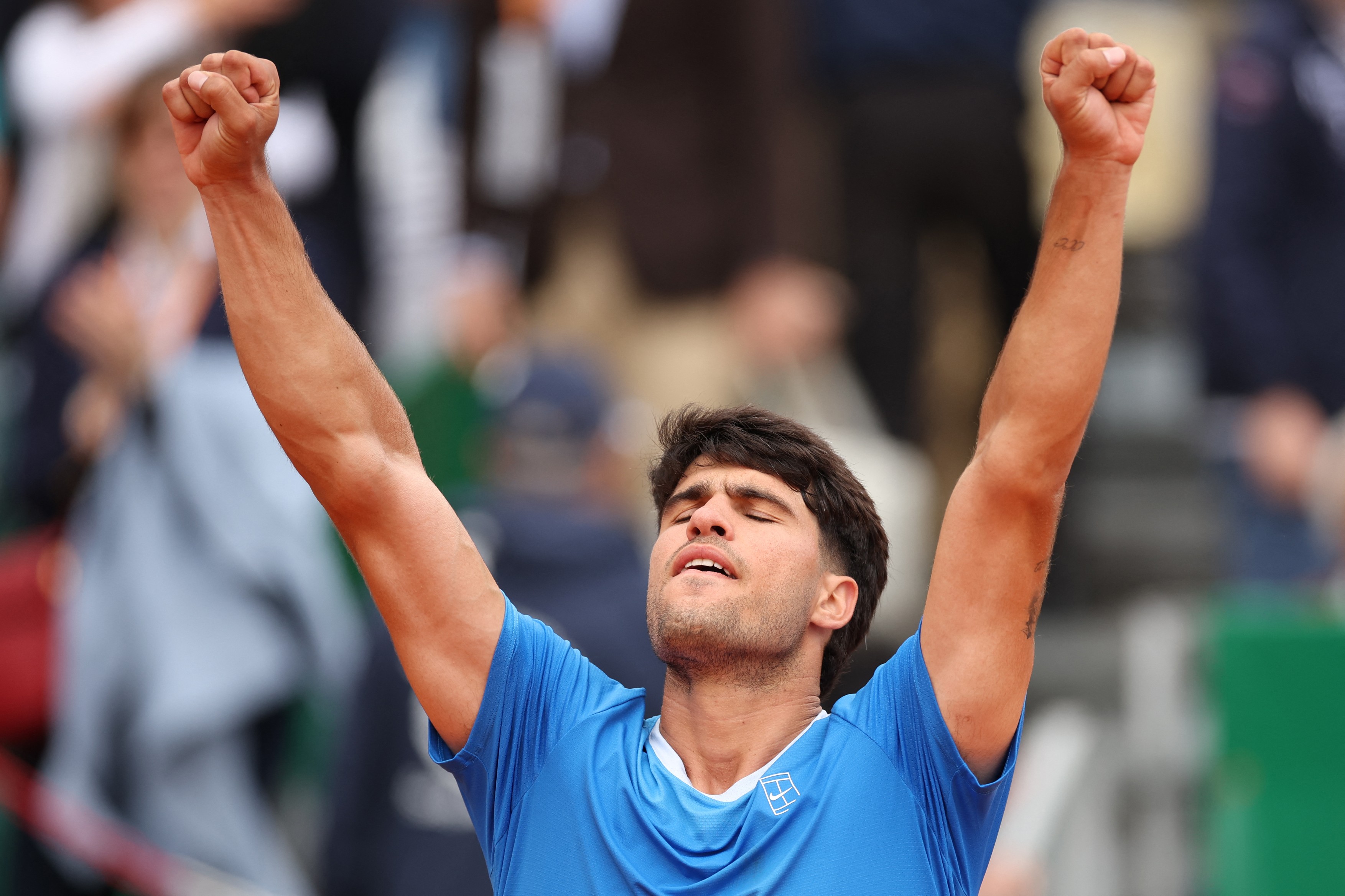 Spain's Carlos Alcaraz celebrates after winning against Argentina's Sebastian Baez
