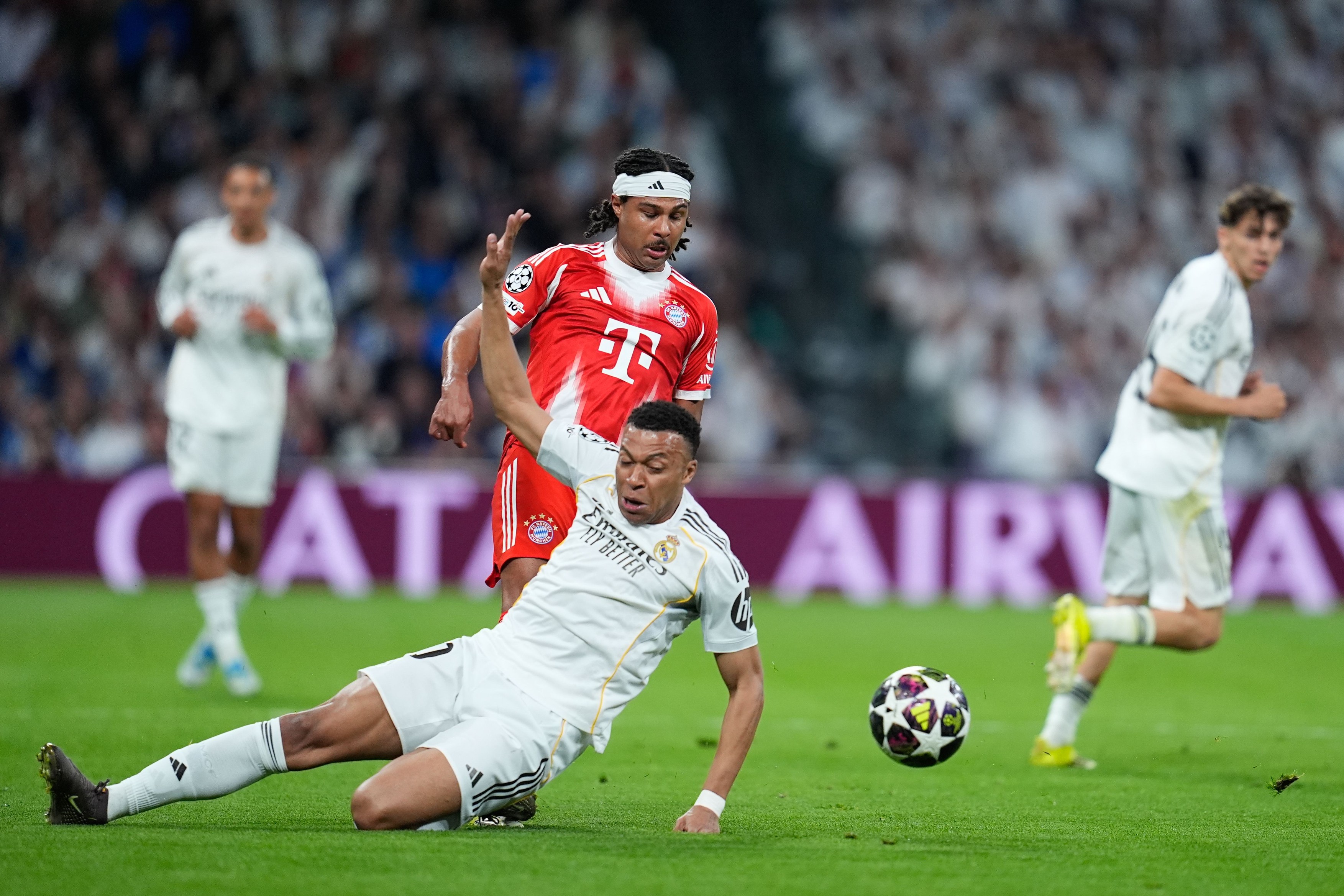 Serge Gnabry of Bayern Munich and Kylian Mbappe of Real Madrid CF