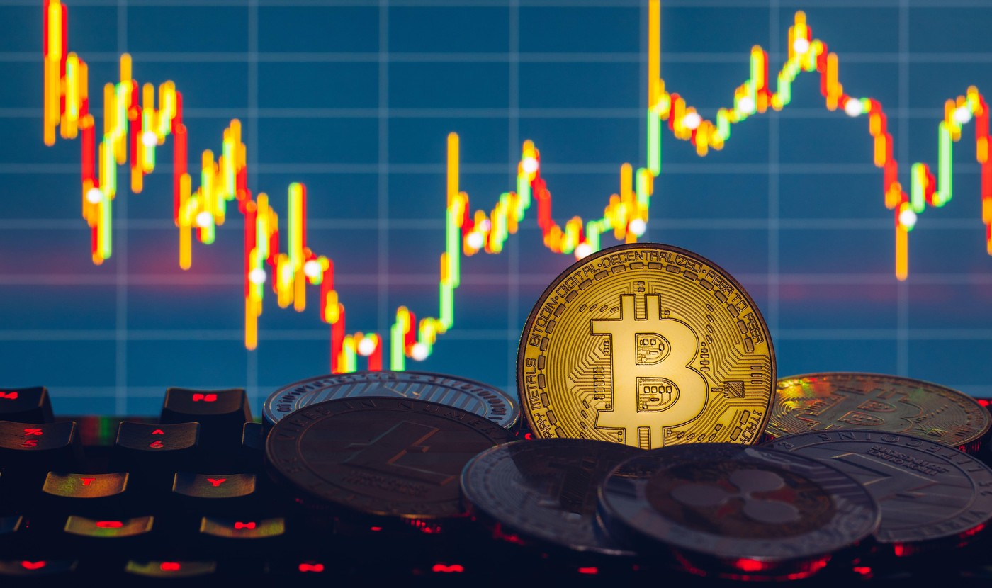 Bitcoin gold coin and defocused chart background