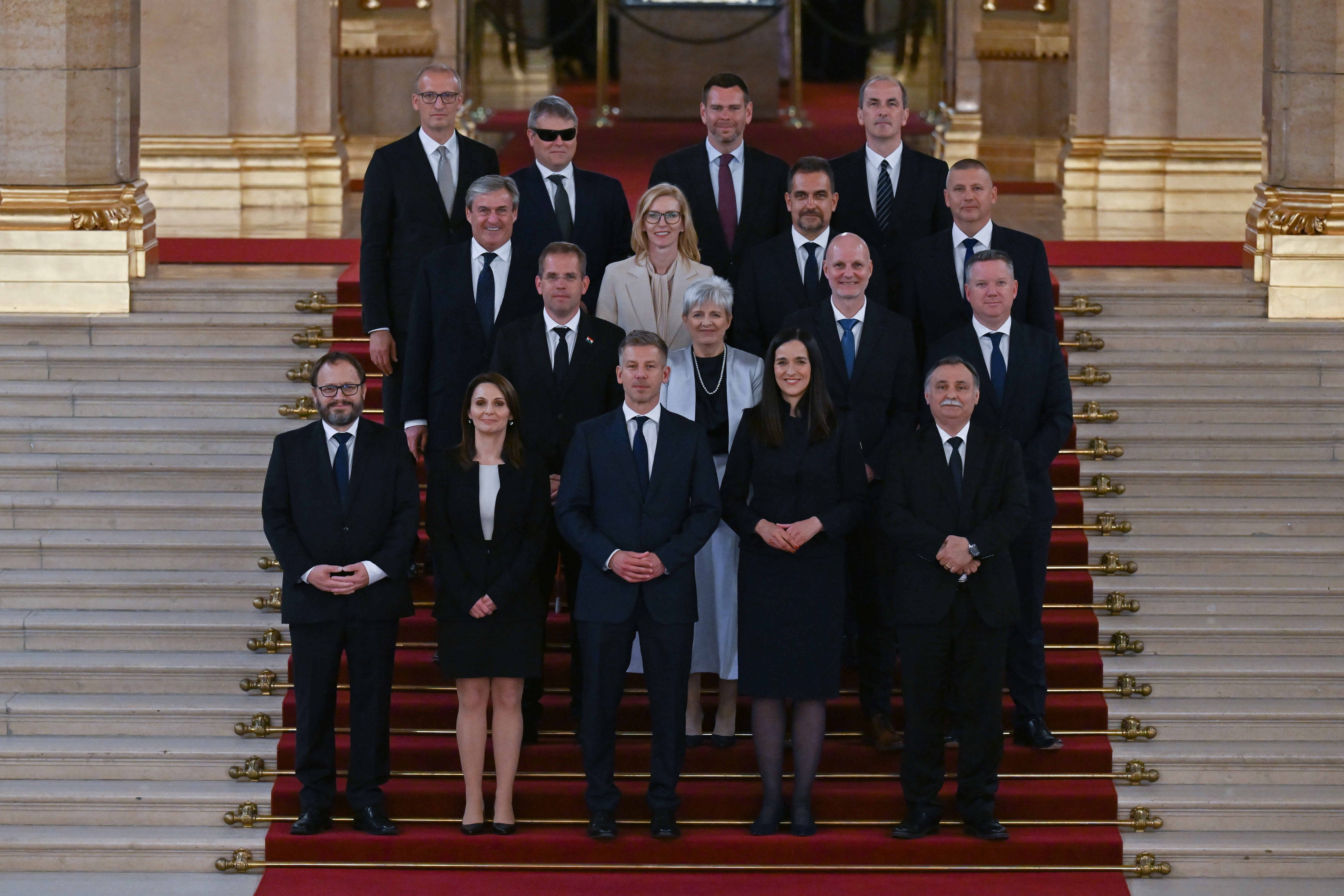 epa12950733 Hungary Prime Minister Peter Magyar (front-C) poses for a family photo with his newly inaugurated cabinet after the plenary session of the new National Assembly in Budapest, Hungary, 12 May 2026.  EPA/Tibor Illyes HUNGARY OUT
