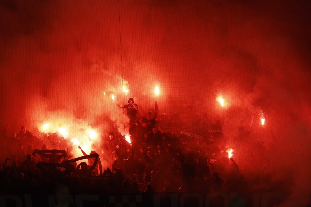 epa12477029 Dinamo Zagreb supporters light flares