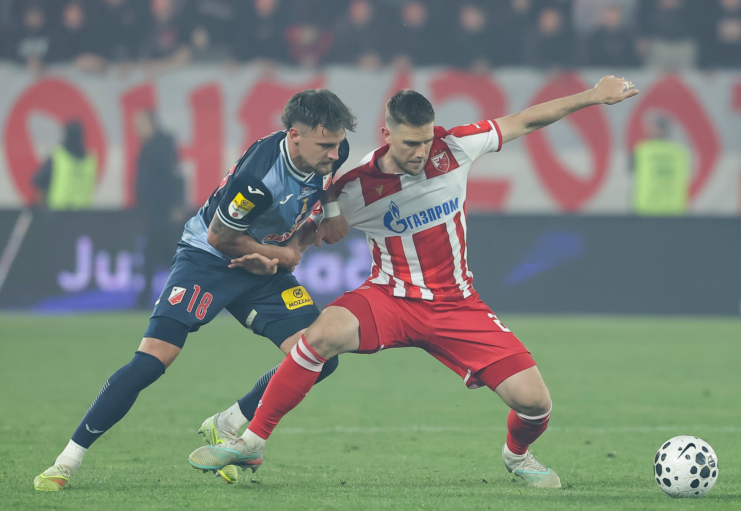 Timi Elsnik (R) of Crvena Zvezda in action against Njegos Petrovic of Vojvodina