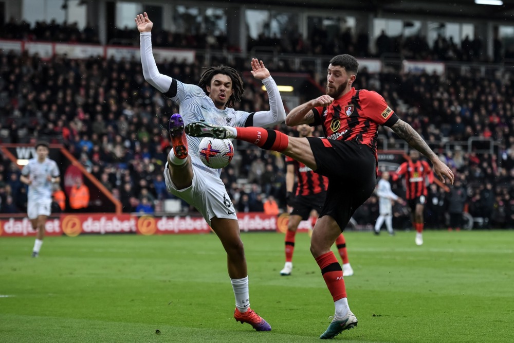 epa10515033 Trent Alexander-Arnold of Liverpool (L) in action against M