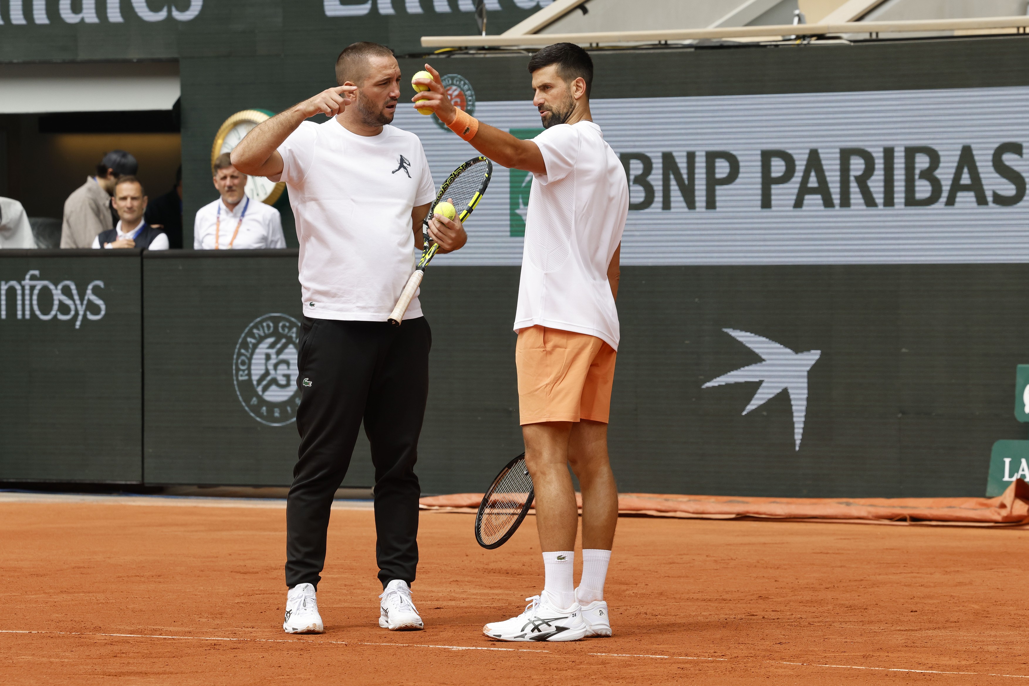 Viktor TROIKI and Novak DJOKOVIC (SRB) in action