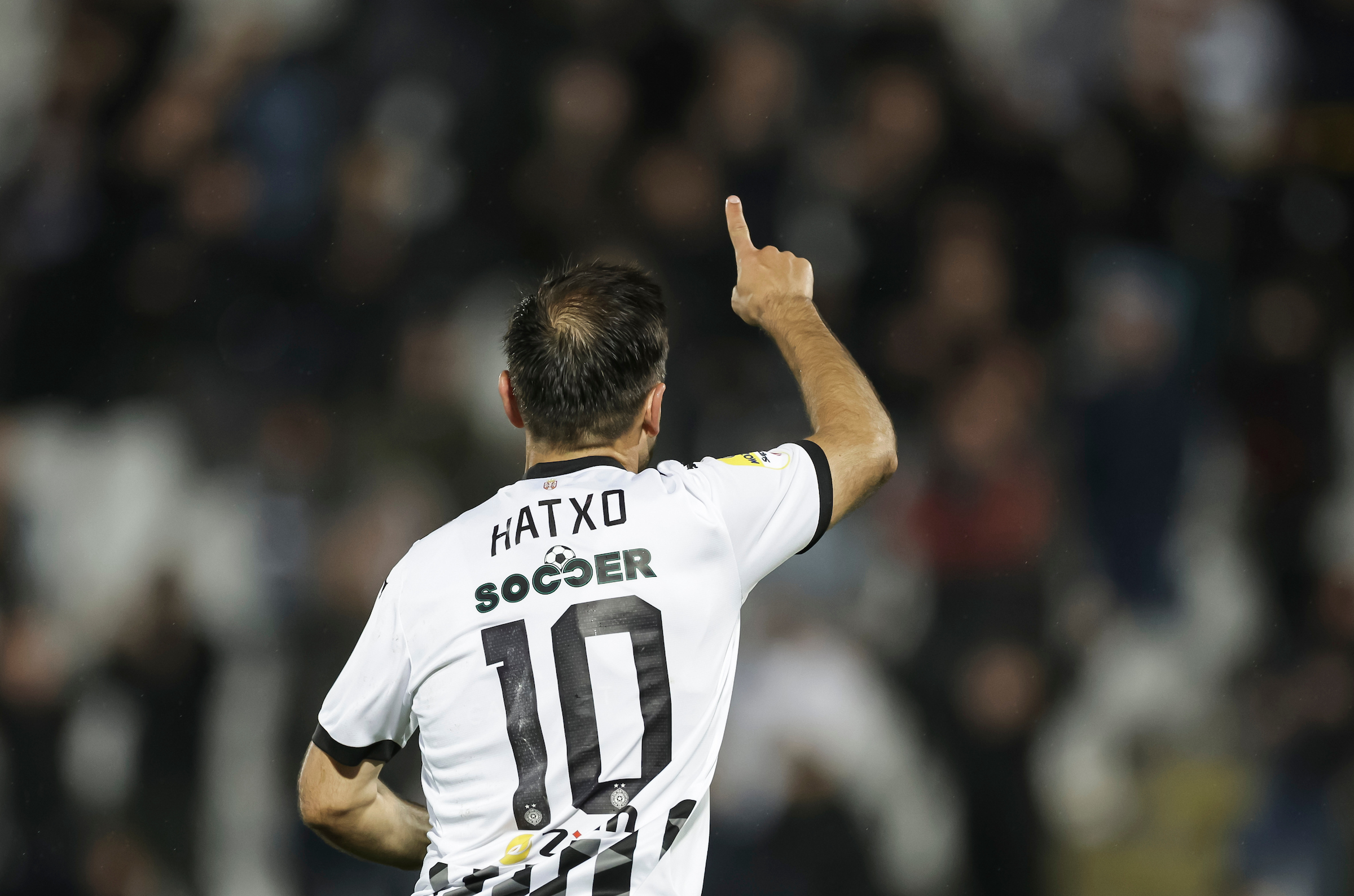 Bibras Natcho (L) of Partizan celebrates after scoring a goal