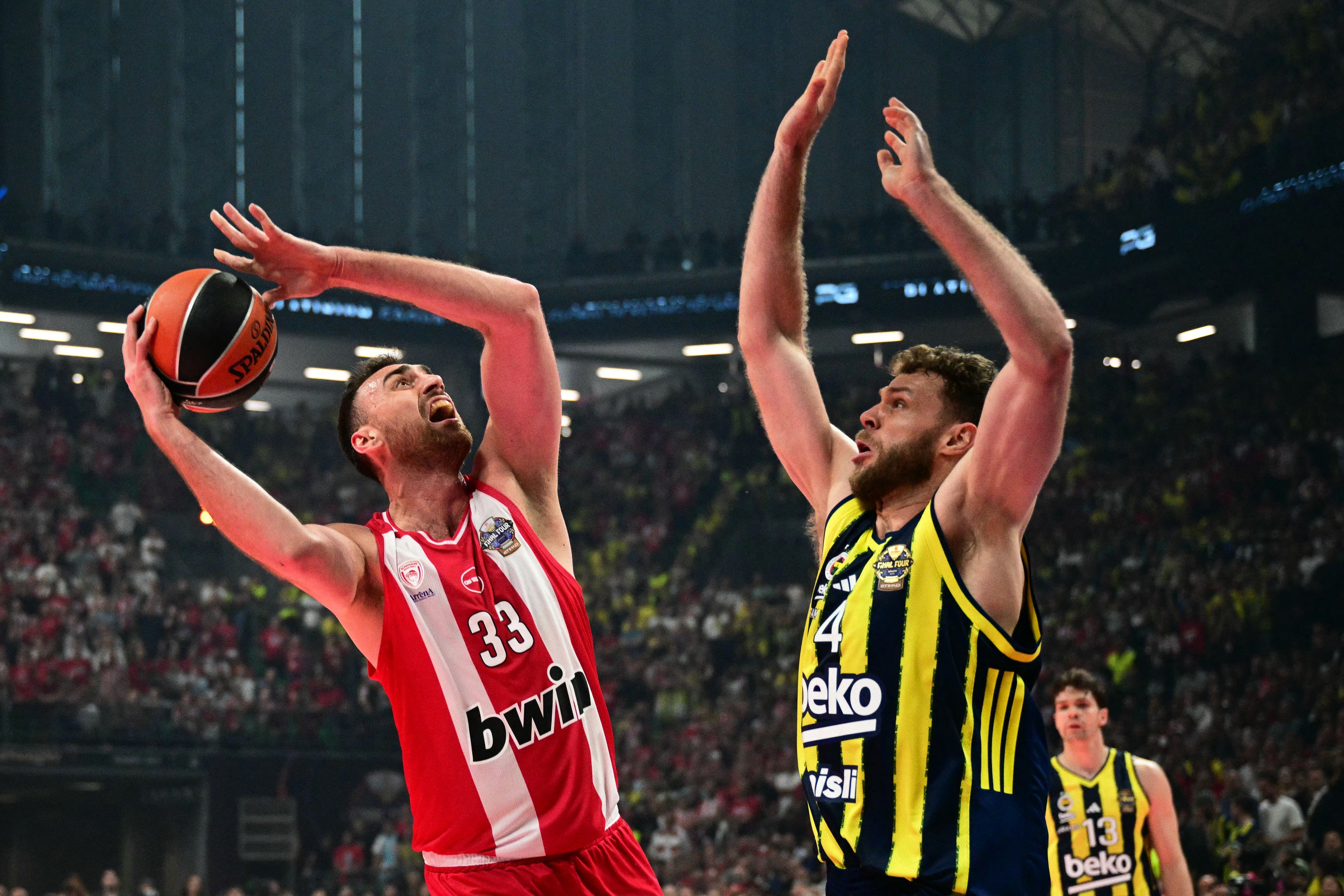 Olympiacos' Serbian centre #33 Nikola Milutinov (L)
