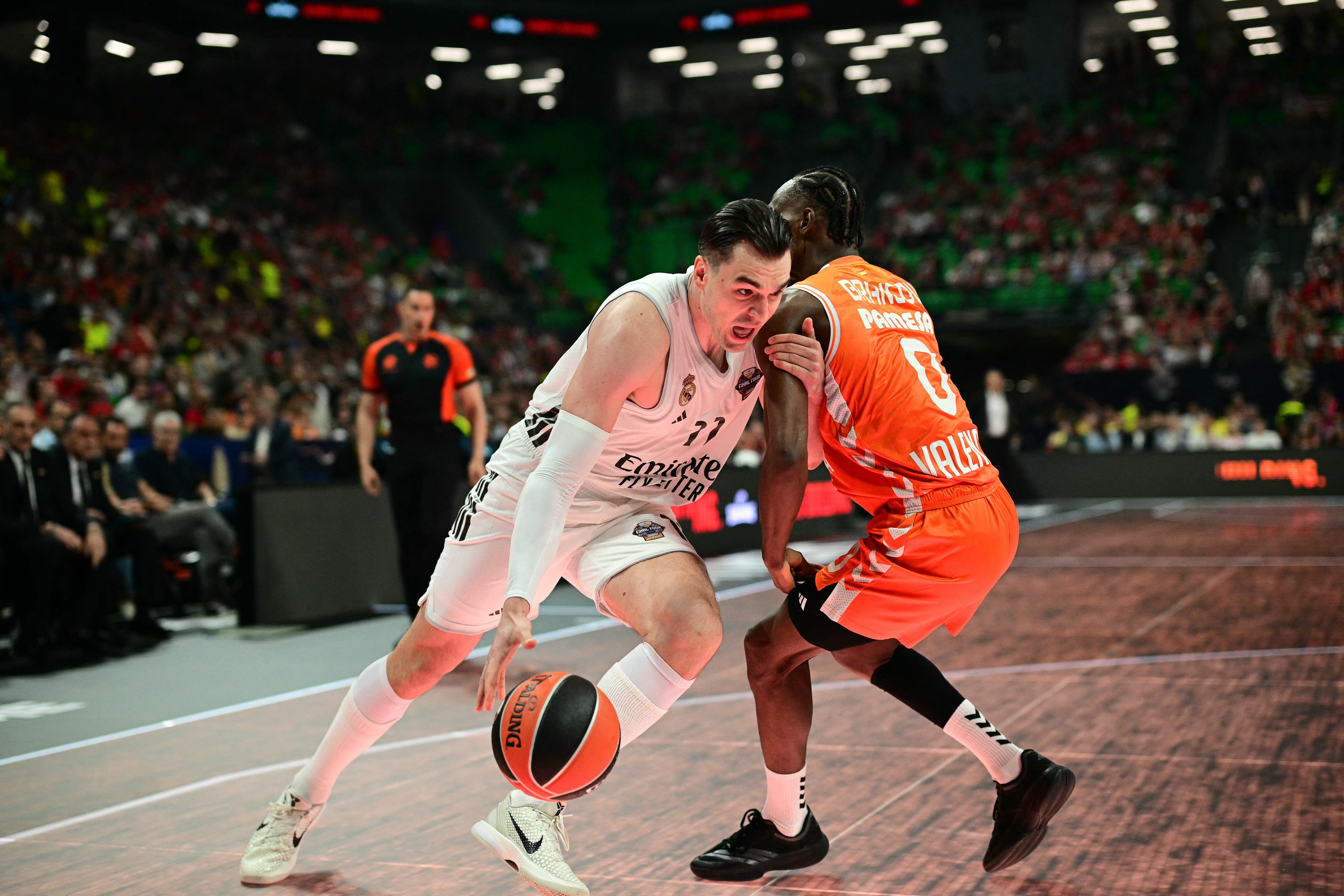 Real Madrid's Croatian forward #11 Mario Hezonja (L)